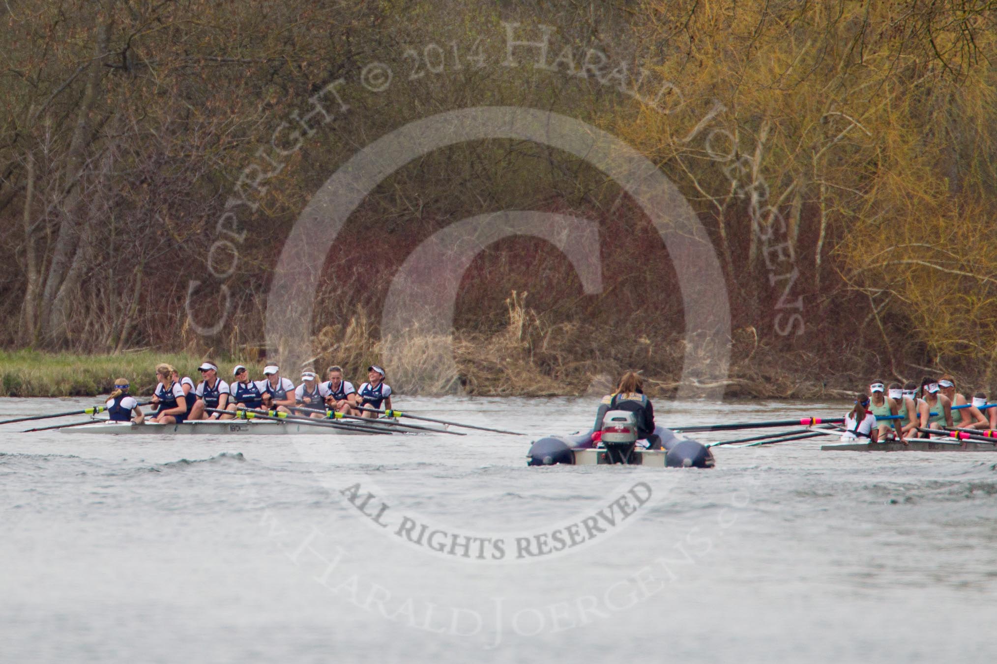 The Women's Boat Race and Henley Boat Races 2014: The Newton Women's Boat Race - the Oxford and Cambridge crews resting for a moment after the race..
River Thames,
Henley-on-Thames,
Buckinghamshire,
United Kingdom,
on 30 March 2014 at 15:16, image #326