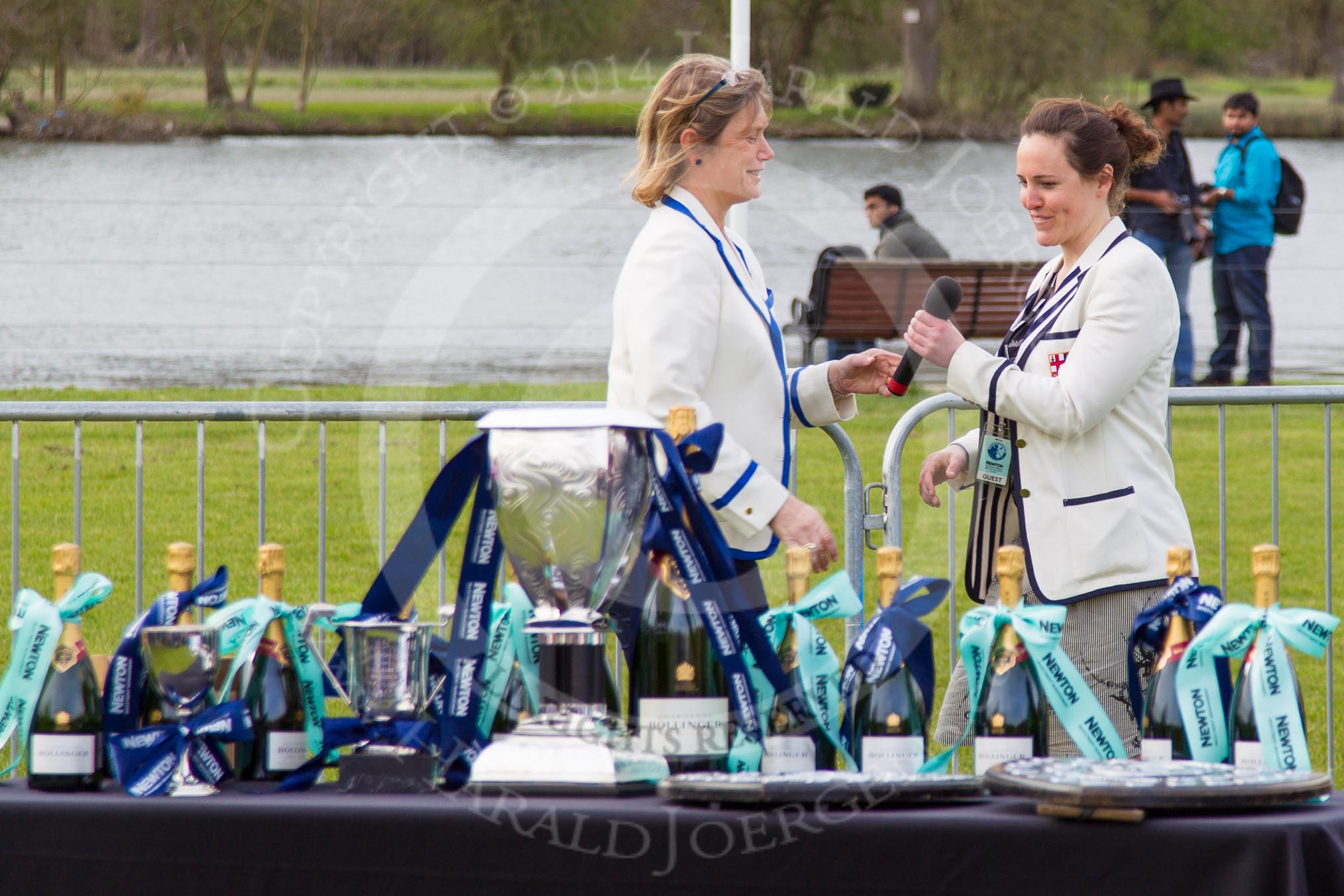 The Women's Boat Race and Henley Boat Races 2014: Judith Behan, head of the Henley Boat Races Organising Committee, handing over the microphone to Sophie Hosking MBE..
River Thames,
Henley-on-Thames,
Buckinghamshire,
United Kingdom,
on 30 March 2014 at 16:48, image #465