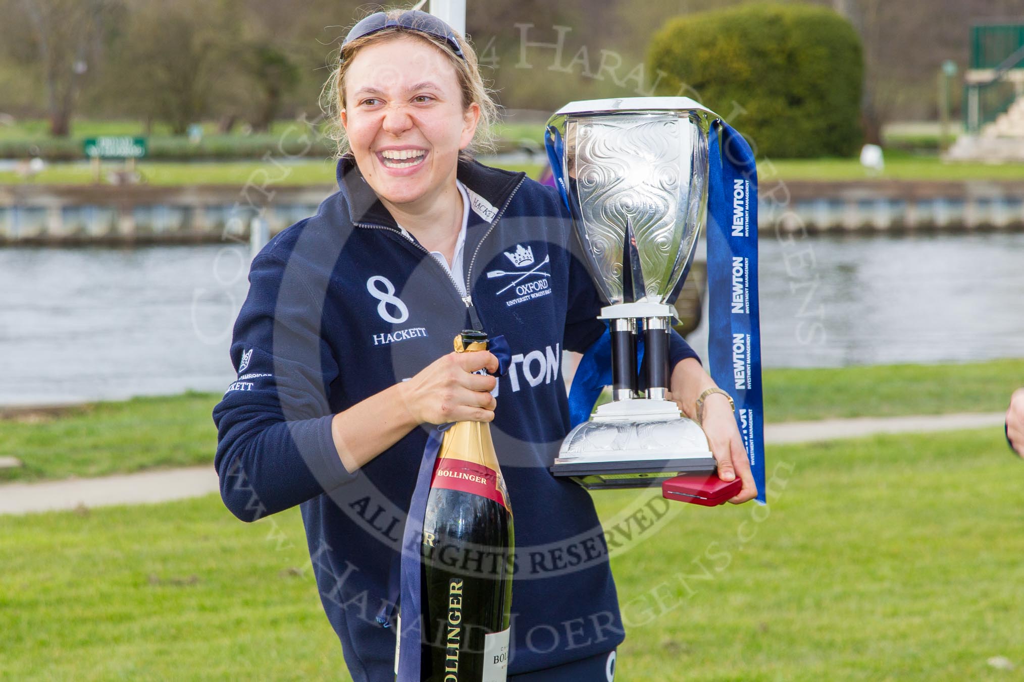 The Women's Boat Race and Henley Boat Races 2014: Maxie Scheske, president of OUWBC, the winner of the Newton Women's Boat Race, with the Newton Women's Boat Race Trophy and a bottle of Bollinger Champagne..
River Thames,
Henley-on-Thames,
Buckinghamshire,
United Kingdom,
on 30 March 2014 at 17:14, image #537