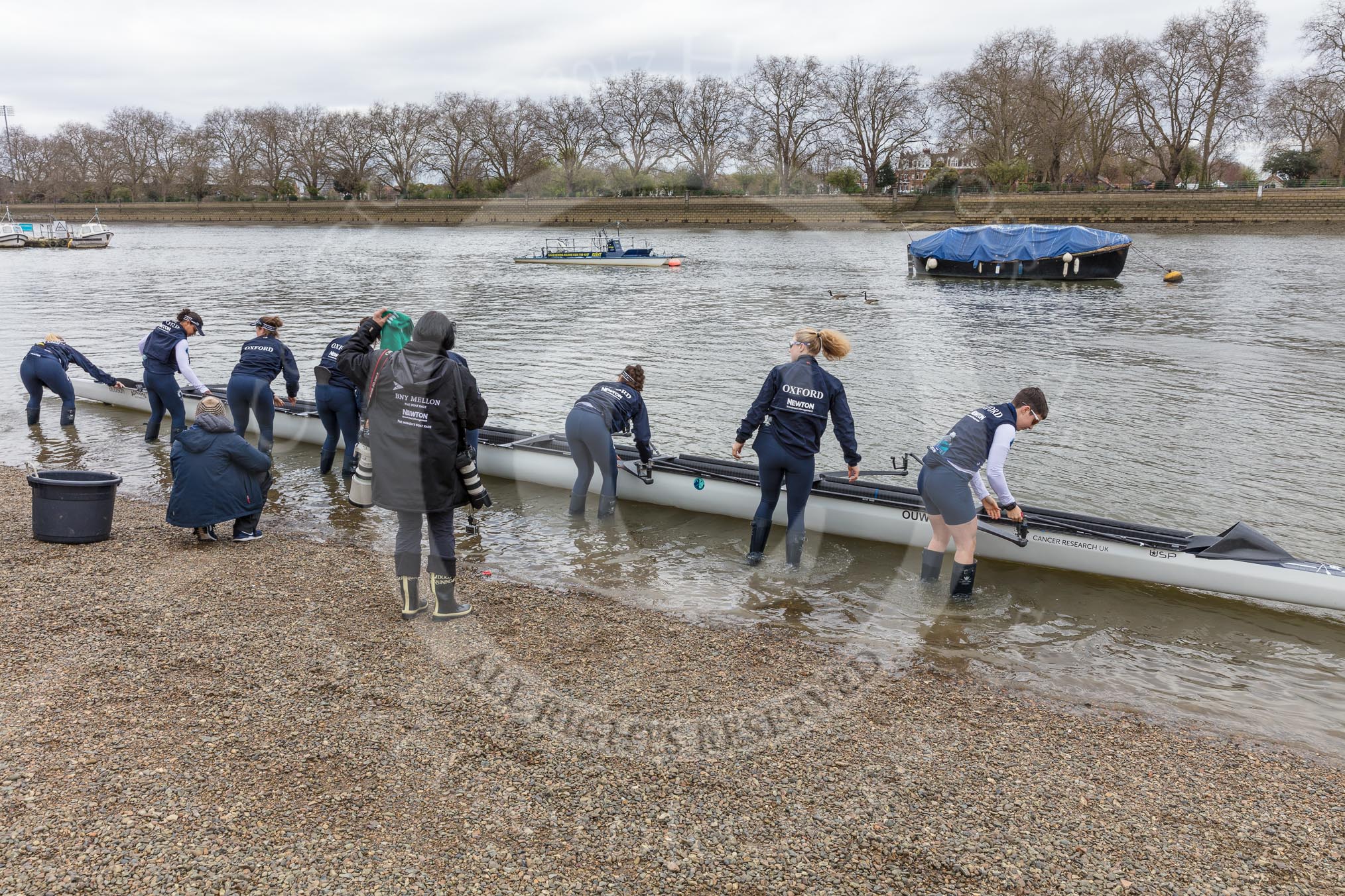 The Cancer Research UK Boat Race season 2017 - Women's Boat Race Fixture OUWBC vs Molesey BC: OUWBC getting their boat ready fro the fixture - S Emily Cameron, 7 Jenna Hebert, 6 Harriet Austin, 5 Chloe Laverack,  4 Rebecca Esselstein,  3 Rebecca Te Water Naude, 2 Beth Bridgman, B Alice Roberts.
River Thames between Putney Bridge and Mortlake,
London SW15,

United Kingdom,
on 19 March 2017 at 15:17, image #6