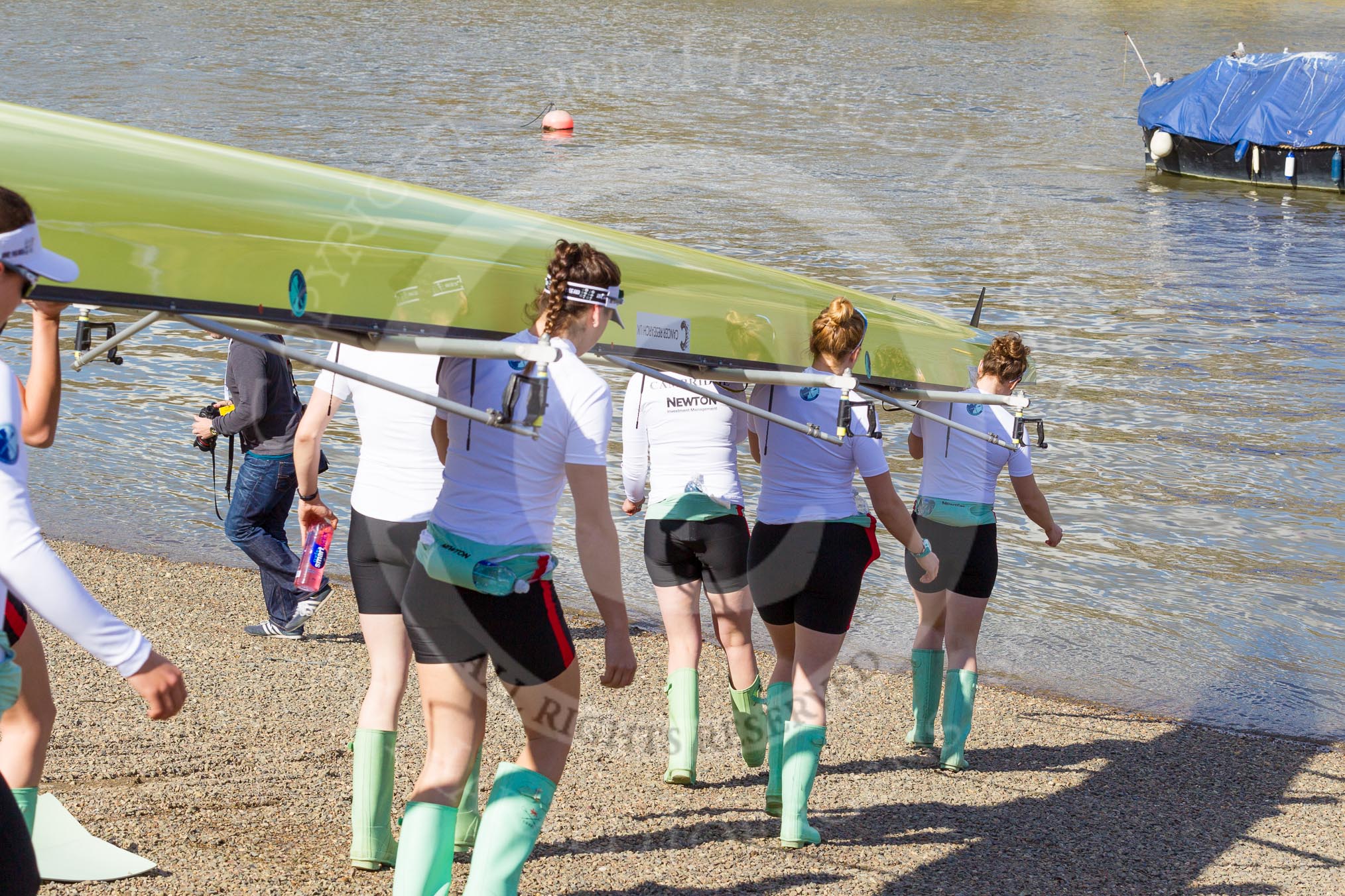 The Boat Race season 2017 -  The Cancer Research Women's Boat Race: CUWBC carrying the Cambridge boat from the boat house to the river.
River Thames between Putney Bridge and Mortlake,
London SW15,

United Kingdom,
on 02 April 2017 at 15:47, image #58