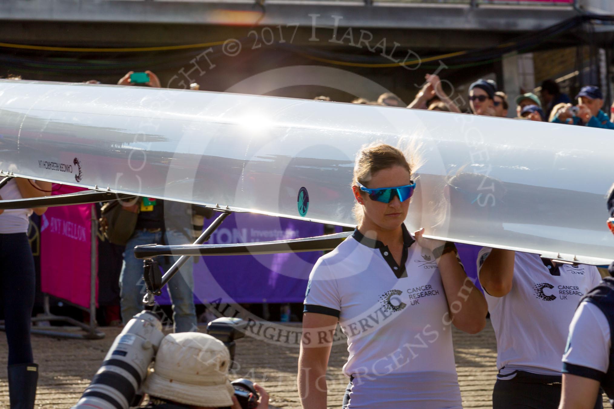 The Boat Race season 2017 -  The Cancer Research Women's Boat Race: OUWBC carrying their boat from the boathouses to the Thames, in front 6 seat Harriet Austin.
River Thames between Putney Bridge and Mortlake,
London SW15,

United Kingdom,
on 02 April 2017 at 15:50, image #78