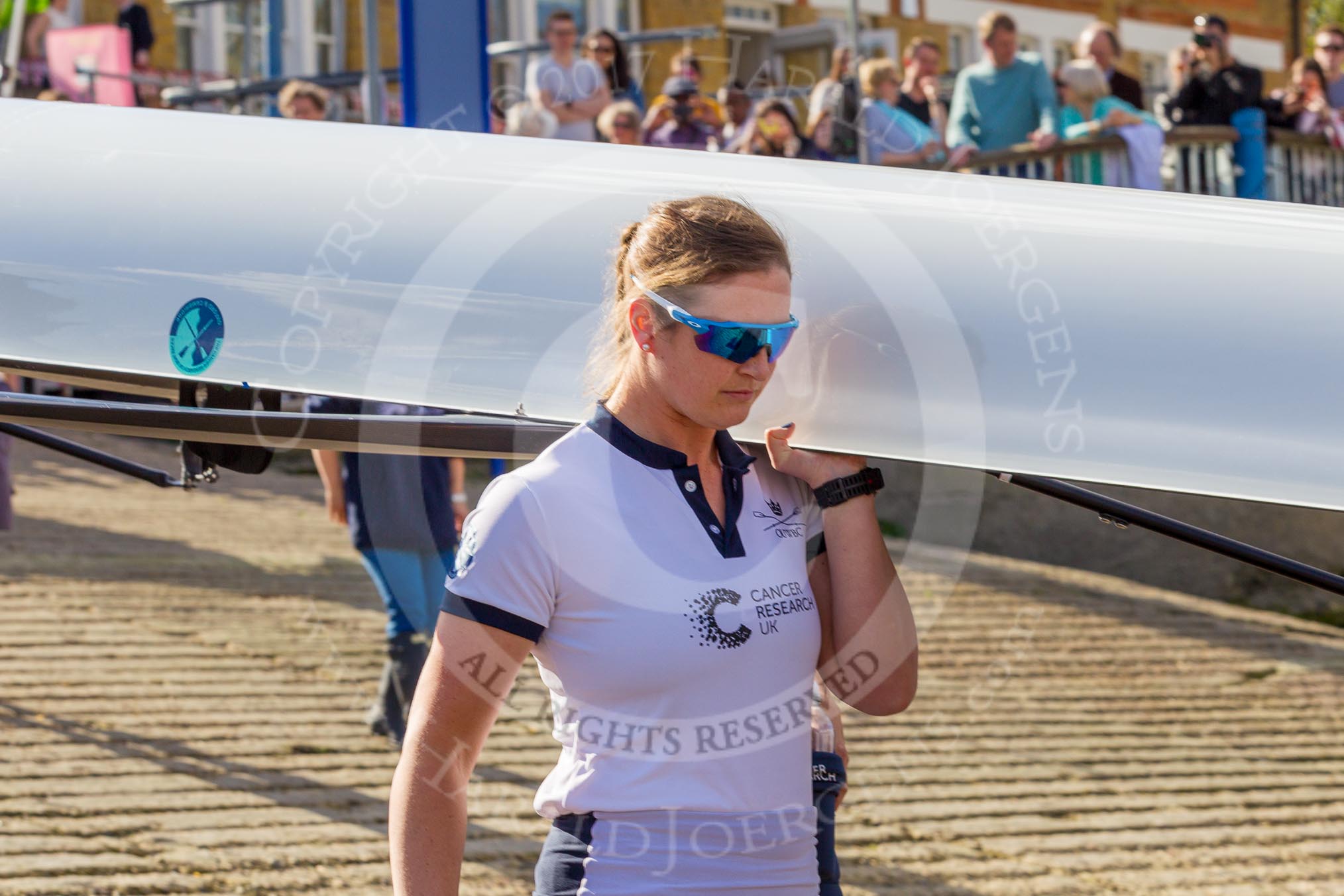 The Boat Race season 2017 -  The Cancer Research Women's Boat Race: OUWBC carrying their boat from the boathouses to the Thames, in front 6 seat Harriet Austin.
River Thames between Putney Bridge and Mortlake,
London SW15,

United Kingdom,
on 02 April 2017 at 15:50, image #79