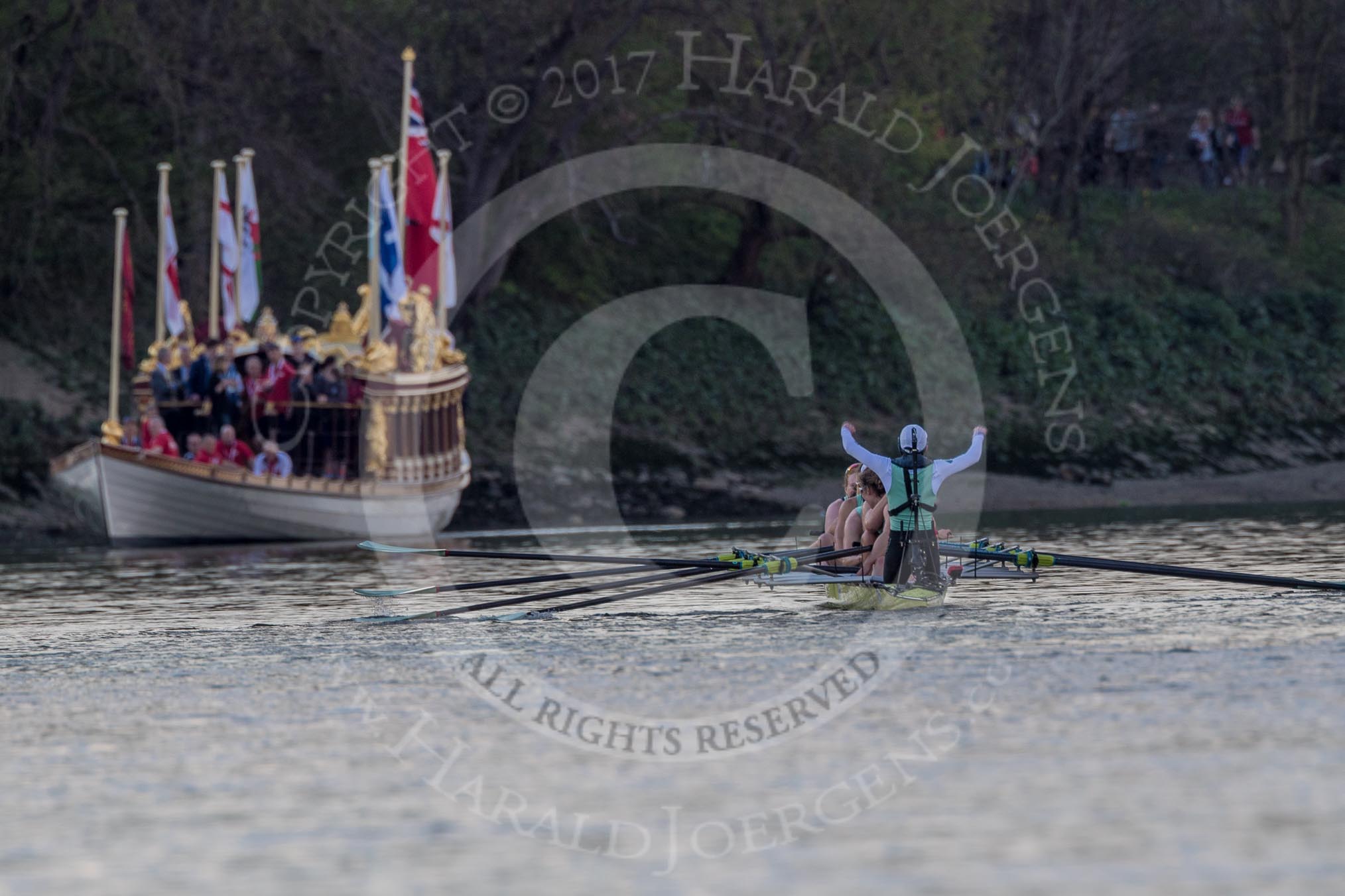 The Boat Race season 2017 -  The Cancer Research Women's Boat Race: Cambridge has won the Women's Boat Race, with jubilant cox Matthew Holland. On the left the Royal Barge Gloriana.
River Thames between Putney Bridge and Mortlake,
London SW15,

United Kingdom,
on 02 April 2017 at 16:54, image #180