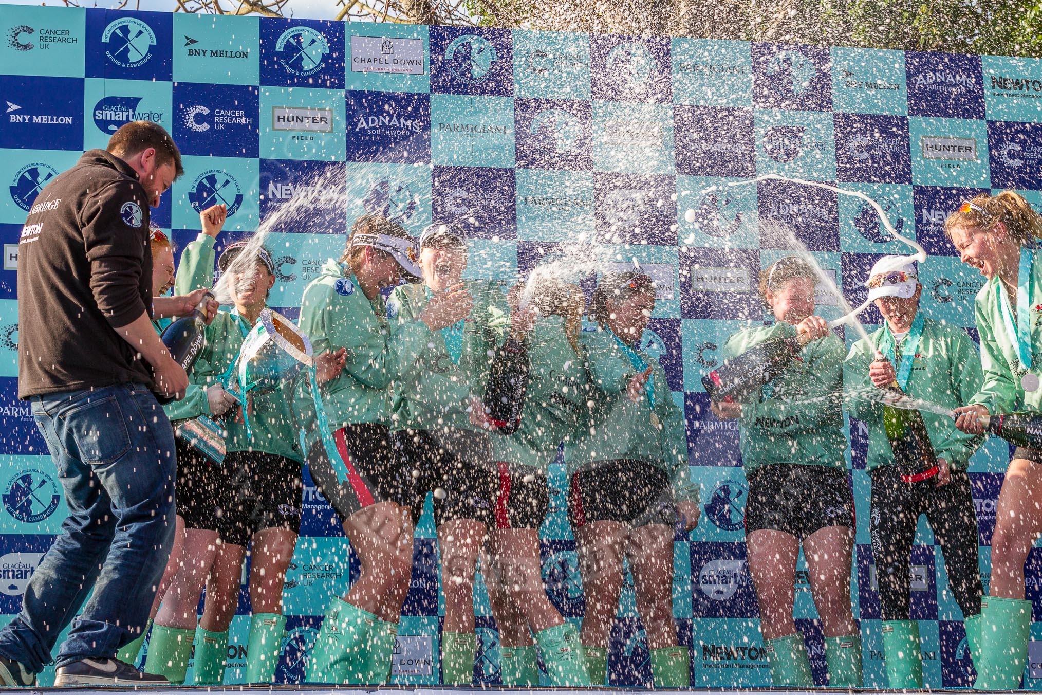 The Boat Race season 2017 -  The Cancer Research Women's Boat Race: CUWBC covered in spray (Cahmpagne, not Thames water) at the price giving.
River Thames between Putney Bridge and Mortlake,
London SW15,

United Kingdom,
on 02 April 2017 at 17:13, image #257