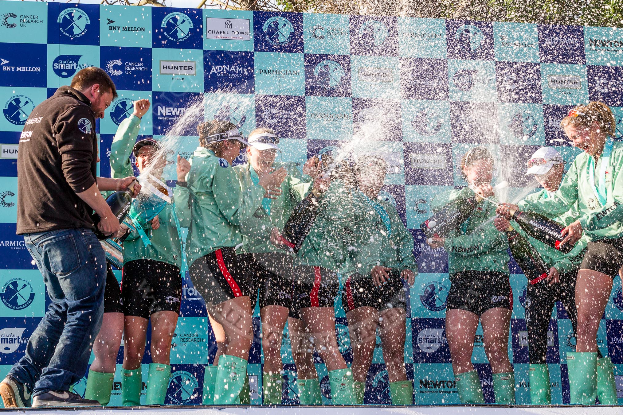 The Boat Race season 2017 -  The Cancer Research Women's Boat Race: CUWBC covered in spray (Cahmpagne, not Thames water) at the price giving.
River Thames between Putney Bridge and Mortlake,
London SW15,

United Kingdom,
on 02 April 2017 at 17:13, image #260