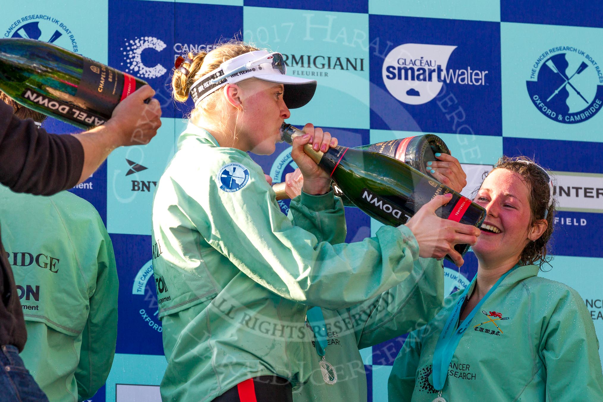 The Boat Race season 2017 -  The Cancer Research Women's Boat Race: CUWBC working hard to empty the bottles of Champagne at the price giving.
River Thames between Putney Bridge and Mortlake,
London SW15,

United Kingdom,
on 02 April 2017 at 17:13, image #280