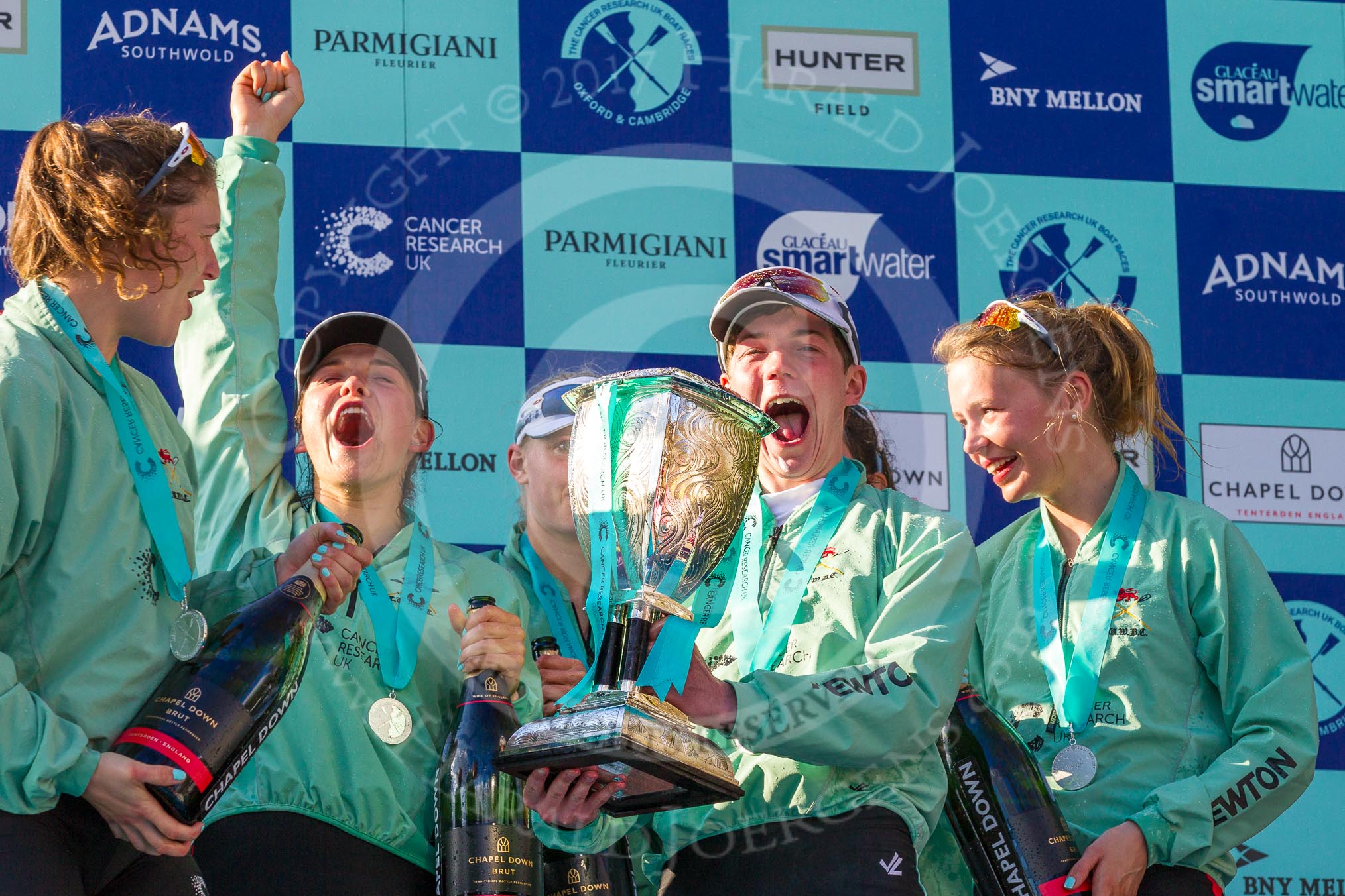 The Boat Race season 2017 -  The Cancer Research Women's Boat Race: CUWBC with the Womwn's Boat Race trophy at the price giving - and a very excited cox Matthew Holland with the Women's Boat Race trophy.
River Thames between Putney Bridge and Mortlake,
London SW15,

United Kingdom,
on 02 April 2017 at 17:14, image #299