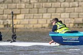 The Boat Race season 2017 -  The Cancer Research Women's Boat Race: A gentleman in the Port of London Authority stake boat holding the CUWBC boat before the start of the race.
River Thames between Putney Bridge and Mortlake,
London SW15,

United Kingdom,
on 02 April 2017 at 16:30, image #115