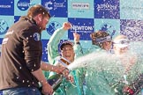 The Boat Race season 2017 -  The Cancer Research Women's Boat Race: CUWBC head coach Rob Barker spraying Champagne at the crew, on his right cox Matthew Holland.
River Thames between Putney Bridge and Mortlake,
London SW15,

United Kingdom,
on 02 April 2017 at 17:13, image #261