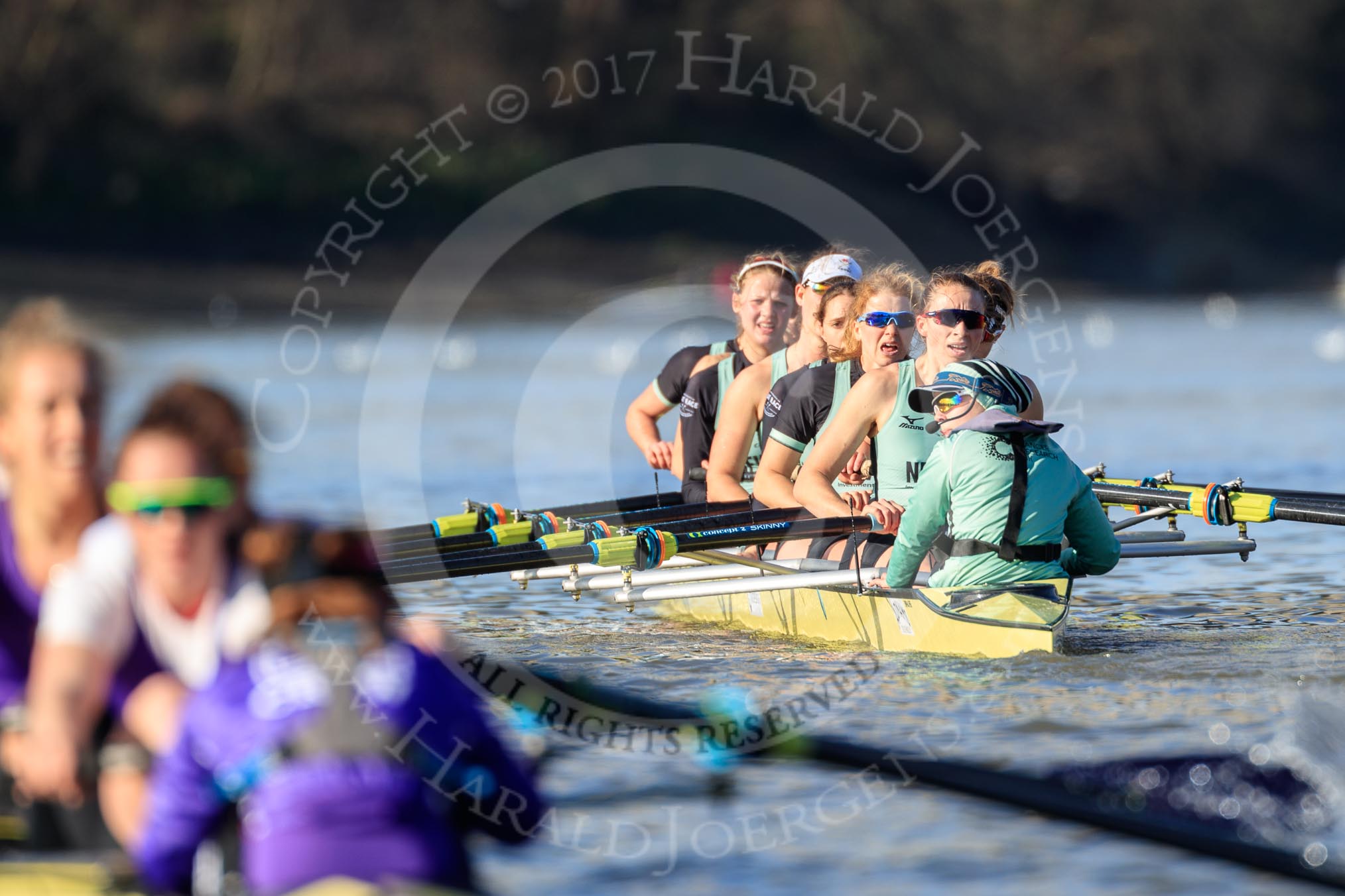 The Women's Boat Race season 2018 - fixture CUWBC vs. ULBC: ULBC and CUWBC - here, in the Cambridge  boat, just having crossed the finish line, bow Olivia Coffey, 2 Myriam Goudet-Boukhatmi, 3 Alice White, 4 Paula Wesselmann, 5 Thea Zabell, 6 Anne Beenken, 7 Imogen Grant, stroke Tricia Smith, cox Sophie Shapter.
River Thames between Putney Bridge and Mortlake,
London SW15,

United Kingdom,
on 17 February 2018 at 13:35, image #170