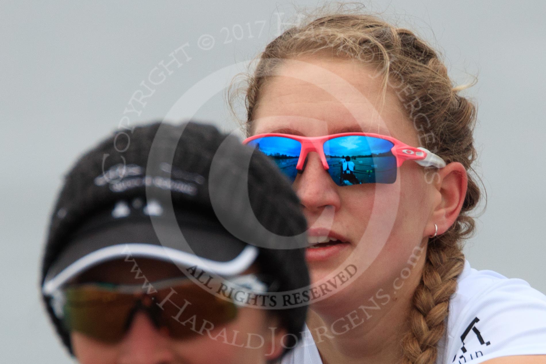 The Women's Boat Race season 2018 - fixture OUWBC vs. Molesey BC: Molesey's 3 seat Gabby Rodriguez and  2 Lucy Primmer, with the boat mirrored in her sunglasses.
River Thames between Putney Bridge and Mortlake,
London SW15,

United Kingdom,
on 04 March 2018 at 13:49, image #74