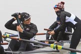 The Women's Boat Race season 2018 - fixture OUWBC vs. Molesey BC: Molesey's 3 seat Gabby Rodriguez about to throw her wellies, 2 seat Lucy Primmer, and bow Emma Boyns.
River Thames between Putney Bridge and Mortlake,
London SW15,

United Kingdom,
on 04 March 2018 at 13:09, image #17