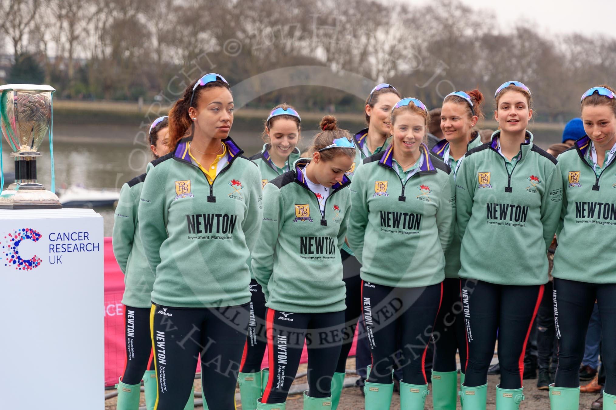 The Cancer Research UK Women's Boat Race 2018: The Cambridge women at the toss - president Daphne Martschenko, cox Sophie Shapter, 6 seat Alice White, 7  Myriam Goudet-Boukhatmi, stroke Olivia Coffey, and behind 2  Imogen Grant, 3 Kelsey Barolak, 4 Thea Zabell, and 5 Paula Wesselmann.
River Thames between Putney Bridge and Mortlake,
London SW15,

United Kingdom,
on 24 March 2018 at 14:40, image #33
