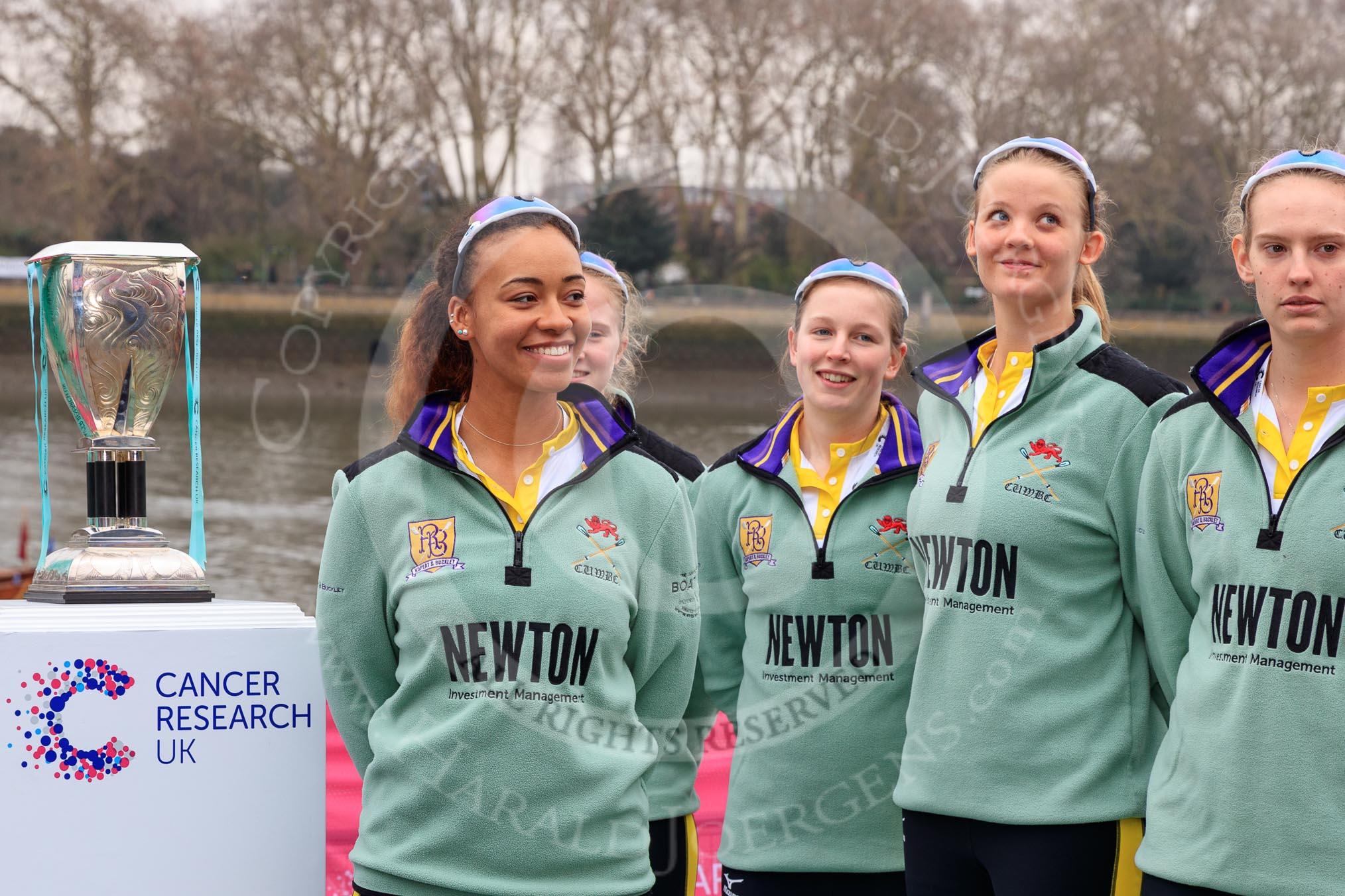 The Cancer Research UK Women's Boat Race 2018: The reserve boat toss - here, for Cambridge's Blondie, CUWBC president Daphne Martschenko, behind her bow seat Pippa Dakin, then 2 Emma Andrews,  3 Anne Beenken,  4 Laura Foster.
River Thames between Putney Bridge and Mortlake,
London SW15,

United Kingdom,
on 24 March 2018 at 14:54, image #66