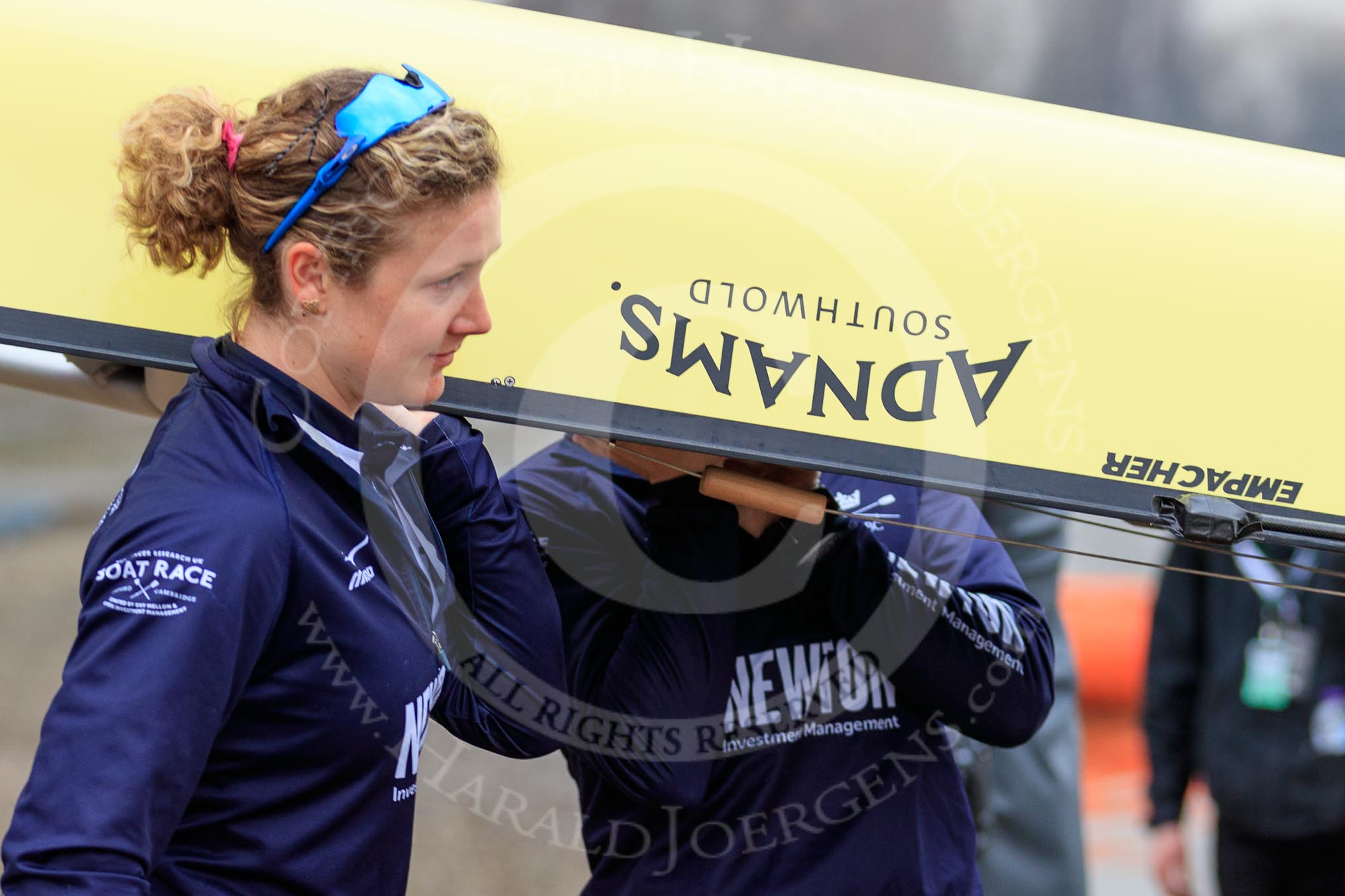 The Cancer Research UK Women's Boat Race 2018: The Oxford women carrying their boat from the boathouse to the river. here 5 seat Morgan McGovern.
River Thames between Putney Bridge and Mortlake,
London SW15,

United Kingdom,
on 24 March 2018 at 15:42, image #94