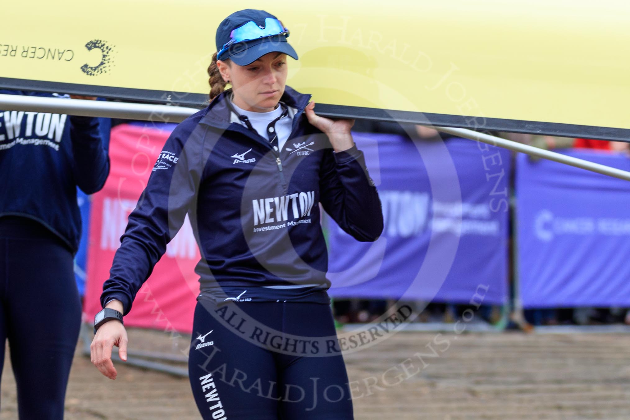 The Cancer Research UK Women's Boat Race 2018: The Oxford women carrying their boat from the boathouse to the river. here 2 seat Katherine Erickson.
River Thames between Putney Bridge and Mortlake,
London SW15,

United Kingdom,
on 24 March 2018 at 15:43, image #95