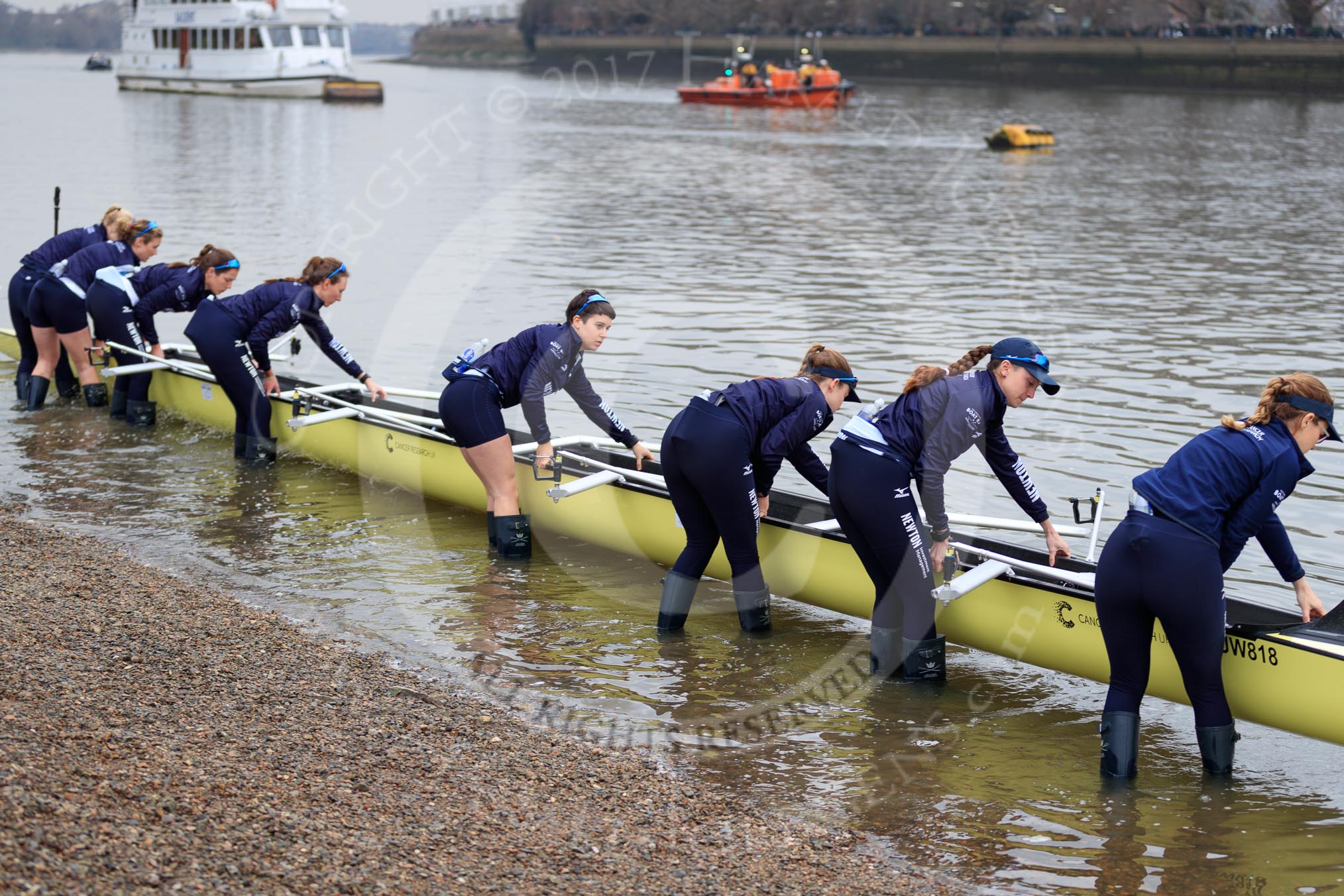 The Cancer Research UK Women's Boat Race 2018: The Oxford Blue Boat crew getting their boat on the river.
River Thames between Putney Bridge and Mortlake,
London SW15,

United Kingdom,
on 24 March 2018 at 15:43, image #98