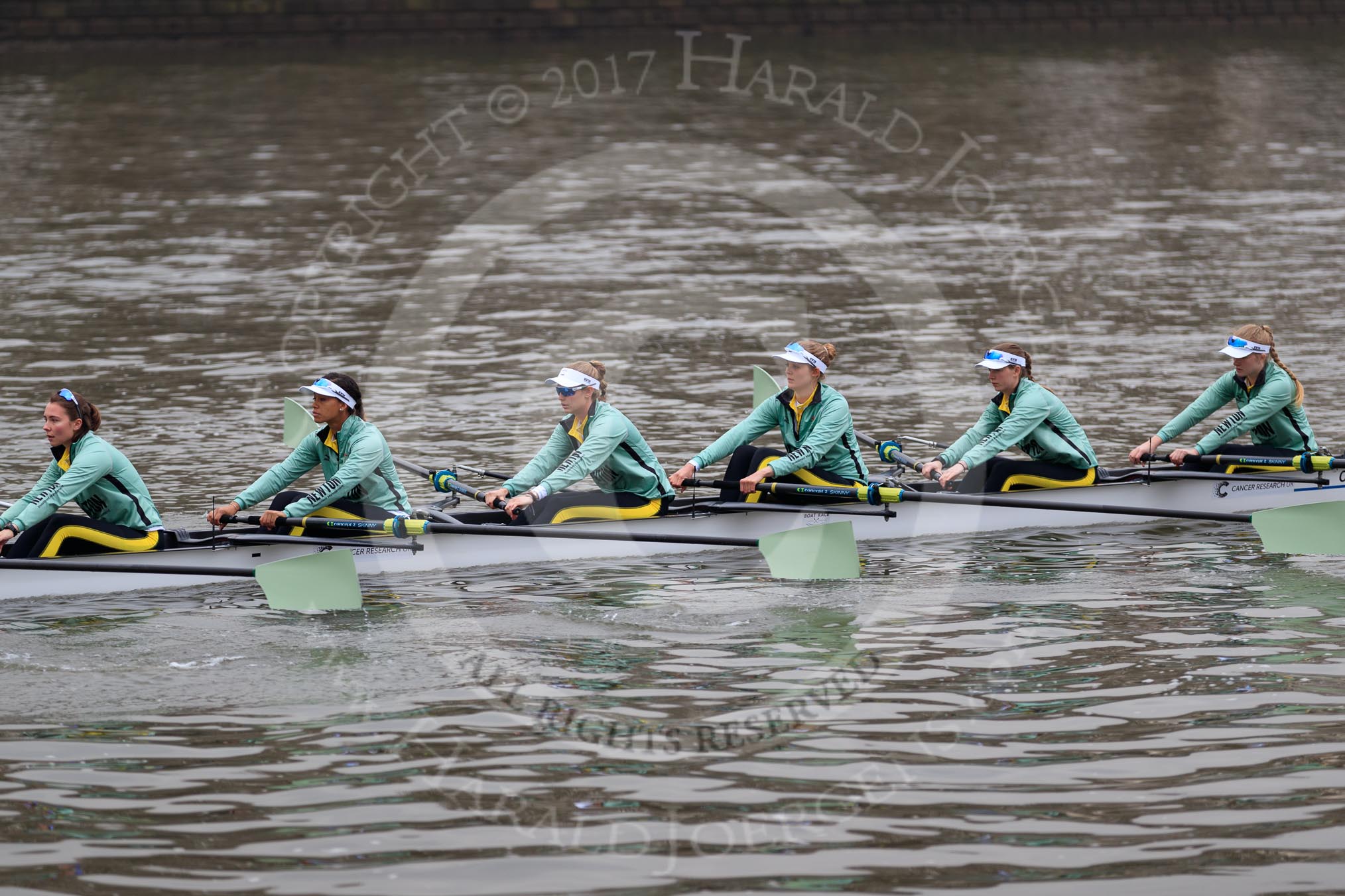The Cancer Research UK Women's Boat Race 2018: The Cambridge reserve boat Blondie, here 6 seat Larkin Sayre, 5 Daphne Martschenko, 4 Laura Foster, 3 Anne Beenken, 2 Emma Andrews, and bow Pippa Dakin.
River Thames between Putney Bridge and Mortlake,
London SW15,

United Kingdom,
on 24 March 2018 at 16:03, image #139