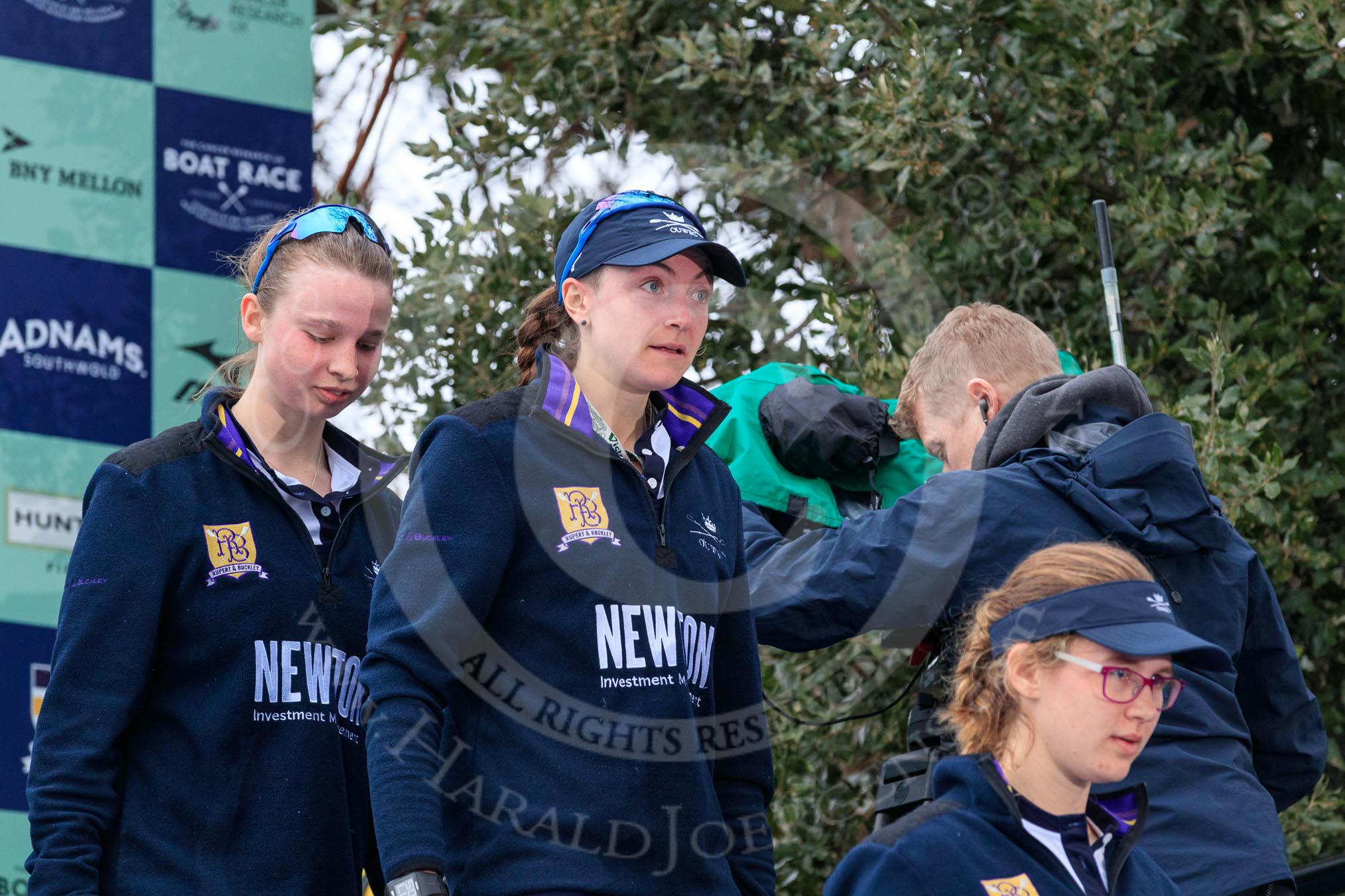 The Cancer Research UK Women's Boat Race 2018: Stepping down from the podium after the race - Oxford' s 3 seat Juliette Perry, 2 Katherine Erickson, and bow Renée Koolschijn.
River Thames between Putney Bridge and Mortlake,
London SW15,

United Kingdom,
on 24 March 2018 at 17:05, image #238
