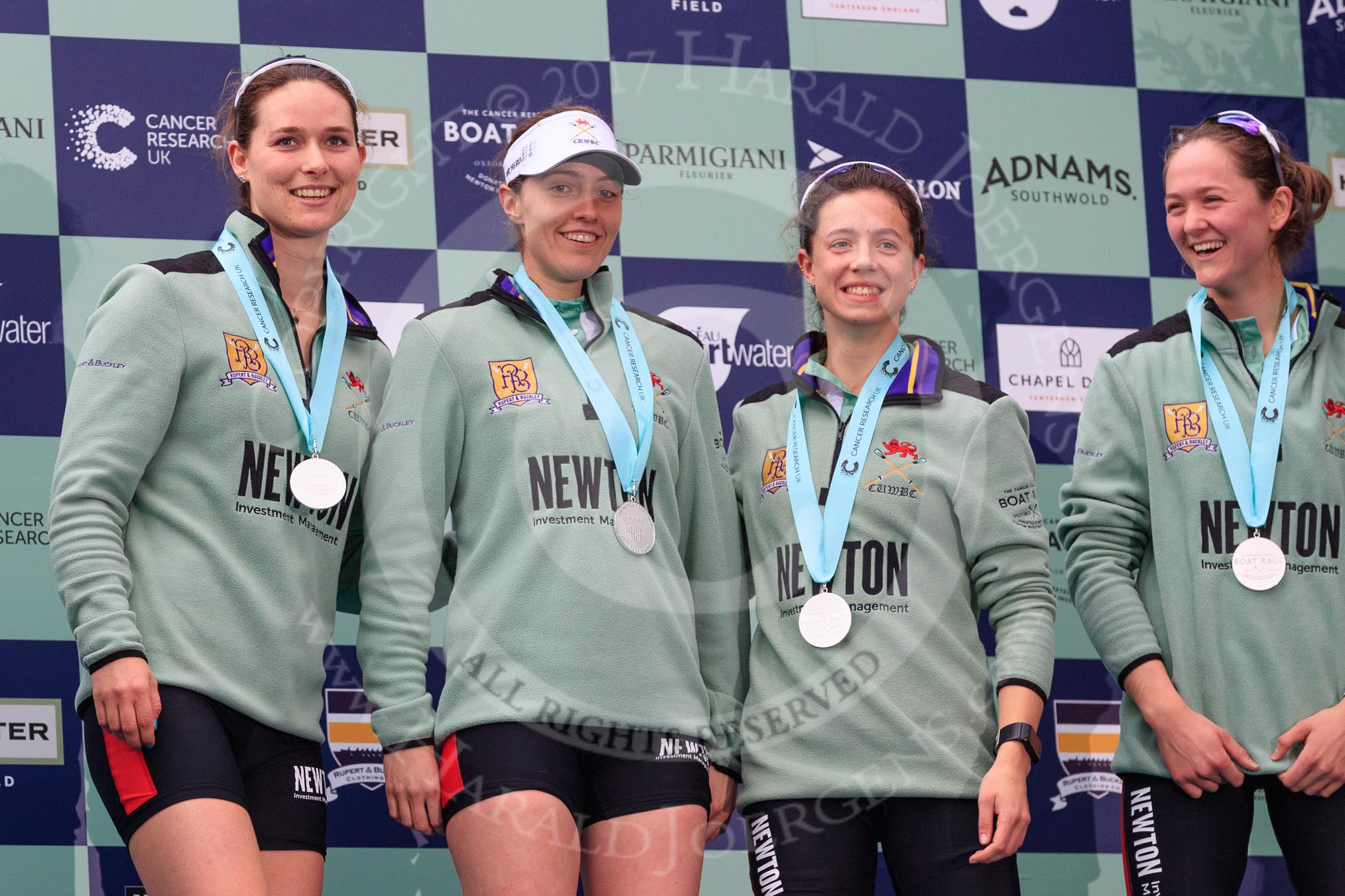 The Cancer Research UK Women's Boat Race 2018: Cambridge 4 seat Thea Zabell, 3 Kelsey Barolak , 2 Imogen Grant, and bow Tricia Smith on the podium.
River Thames between Putney Bridge and Mortlake,
London SW15,

United Kingdom,
on 24 March 2018 at 17:07, image #259