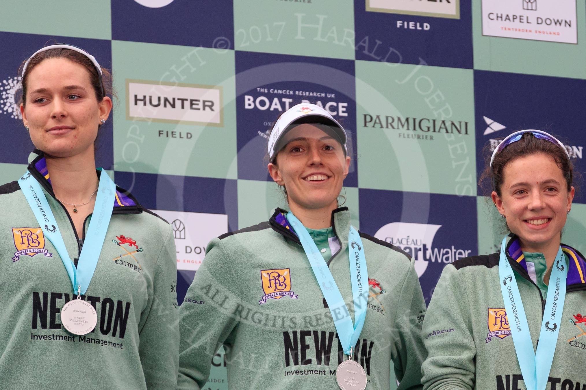 The Cancer Research UK Women's Boat Race 2018: cambridge 4 seat Thea Zabell, 3 Kelsey Barolak, and 2 Imogen Grant on the podium, with their Boat Race medals.
River Thames between Putney Bridge and Mortlake,
London SW15,

United Kingdom,
on 24 March 2018 at 17:07, image #260