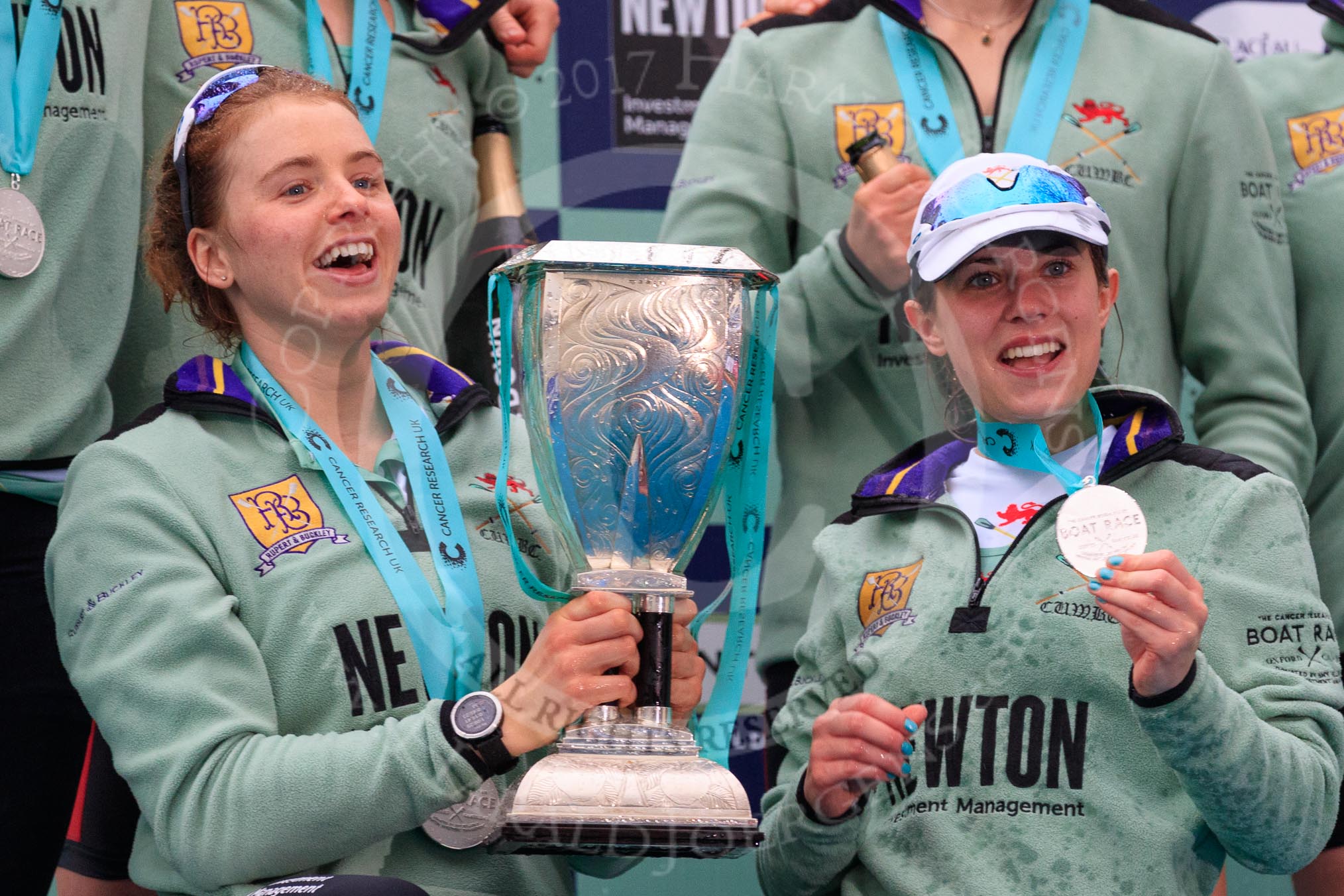 The Cancer Research UK Women's Boat Race 2018: The Cambridge women celebrating with their Boat Race medals, the Women's Boat Race trophy, and lots of Chapel Down Brut: Here Alice White, and Sophie Shapter.
River Thames between Putney Bridge and Mortlake,
London SW15,

United Kingdom,
on 24 March 2018 at 17:09, image #298