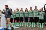 The Cancer Research UK Women's Boat Race 2018: The toss for the Women's Boat Race reserve boats, here, almost hidden, CUWBC president, and 5 seat Daphne Martschenko, then 2 seat Emma Andrews, 3 Anne Beenken, 4 Laura Foster, 6 Larkin Sayre, 7 Lucy Pike, stroke Millie Perrin, cox Sophie Wrixon.
River Thames between Putney Bridge and Mortlake,
London SW15,

United Kingdom,
on 24 March 2018 at 14:55, image #69