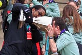 The Cancer Research UK Women's Boat Race 2018: The Women's Boat Race trophy is carried away, with CUWBC club coordinator James Lee volunteering to drink the remaining Chapel Down Brut from it.
River Thames between Putney Bridge and Mortlake,
London SW15,

United Kingdom,
on 24 March 2018 at 17:15, image #320