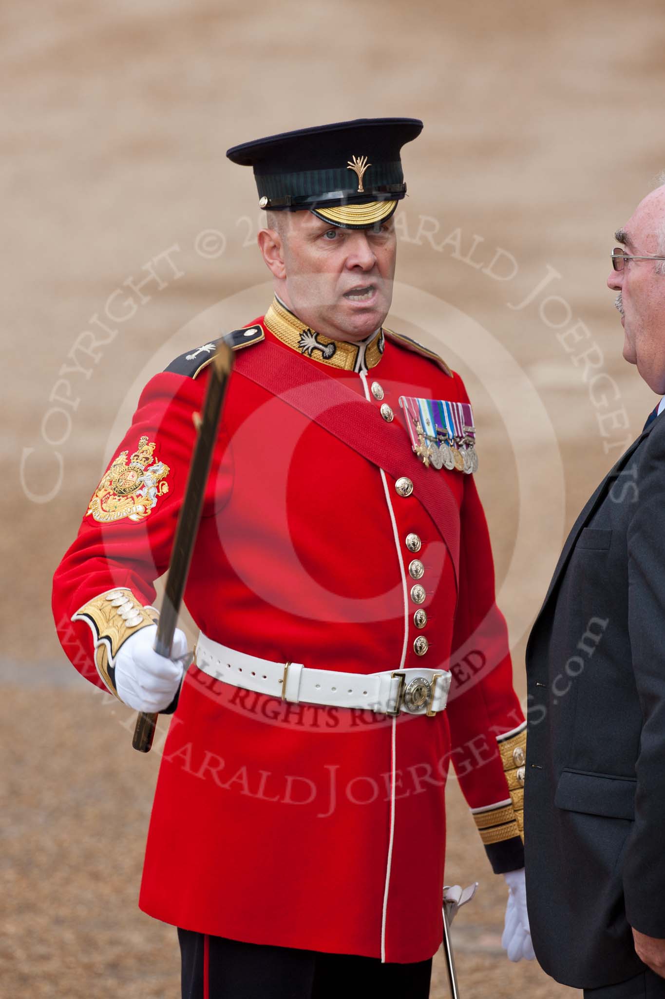 Trooping the Colour 2009: WO1 (GSM) W D G 'Billy' Mott OBE, Welsh Guards, talking to a visitor..
Horse Guards Parade, Westminster,
London SW1,

United Kingdom,
on 13 June 2009 at 09:44, image #14