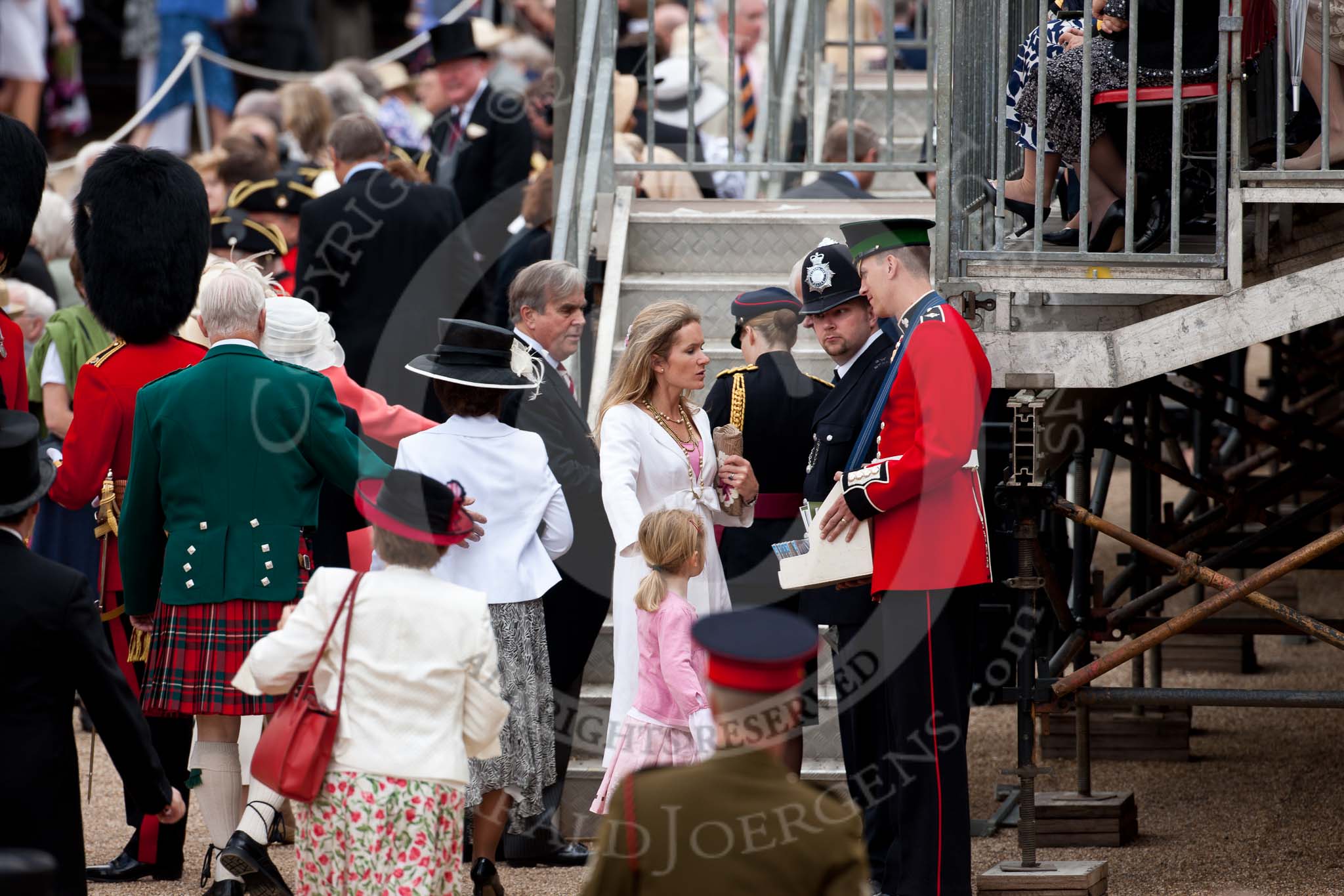 Trooping the Colour 2009: Guardsman selling programmes whilst visitors are on their way to their seats..
Horse Guards Parade, Westminster,
London SW1,

United Kingdom,
on 13 June 2009 at 10:03, image #19