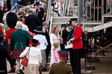 Trooping the Colour 2009: Guardsman selling programmes whilst visitors are on their way to their seats..
Horse Guards Parade, Westminster,
London SW1,

United Kingdom,
on 13 June 2009 at 10:03, image #19