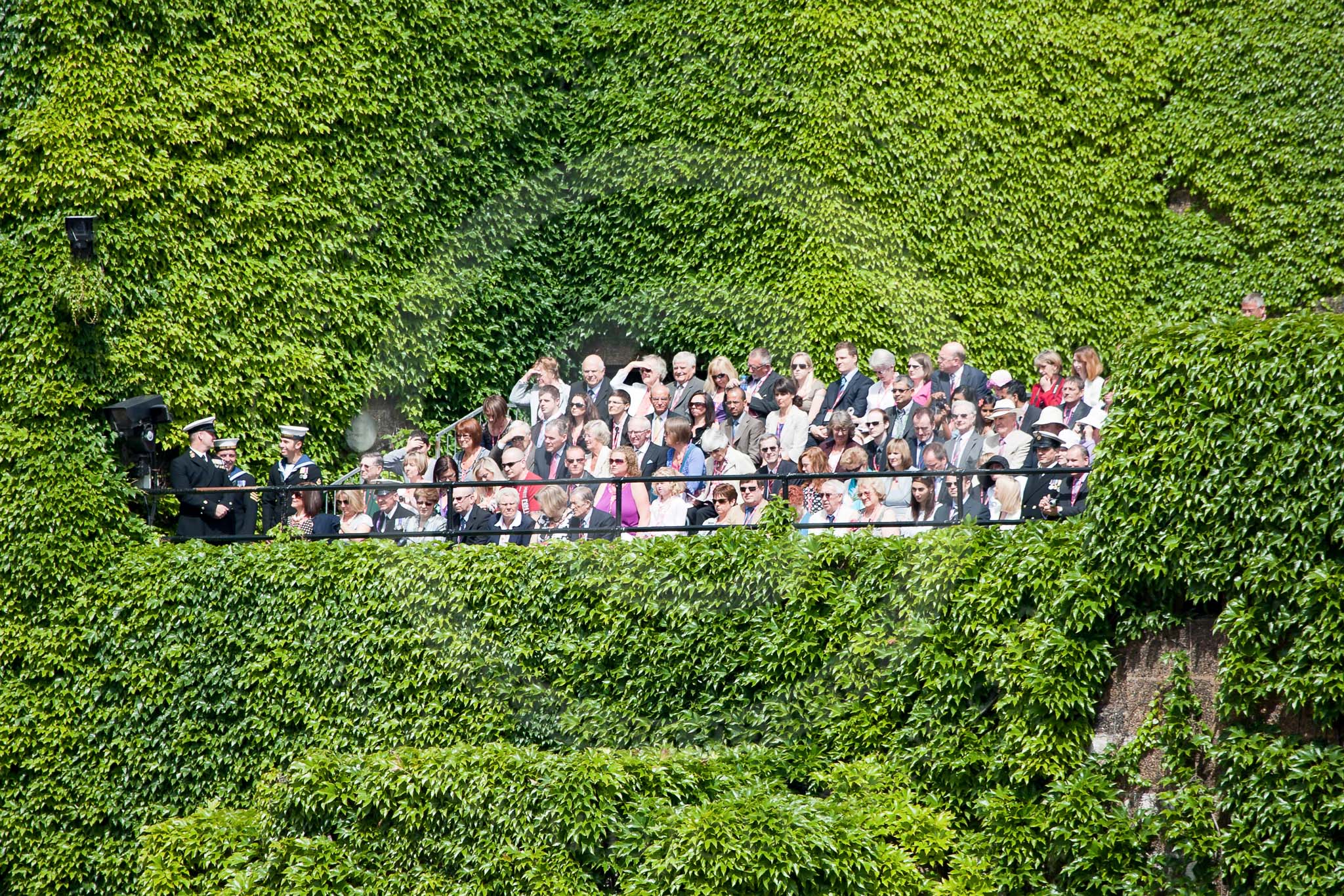 Trooping the Colour 2010: Spectators watching from the Admiralty Citadel, a war time, bomb-proop operations centre for the admiralty. The building is still used by the Ministry of Defence.

It is covered in ivy, making the structure appear leass bunker-like..
Horse Guards Parade, Westminster,
London SW1,
Greater London,
United Kingdom,
on 12 June 2010 at 10:52, image #45