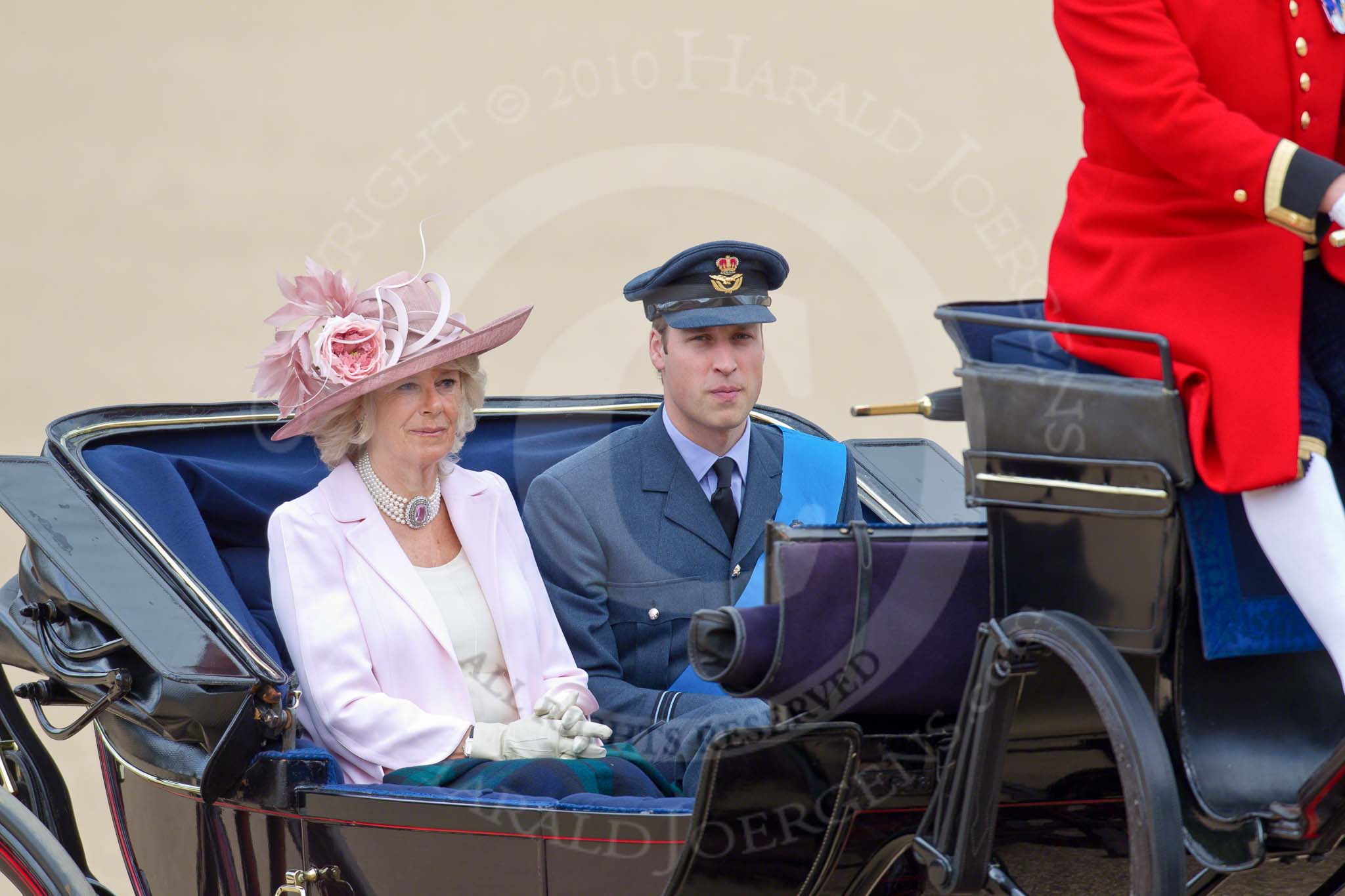 Trooping the Colour 2010: Prince William elser son elder son of Charles, Prince of Wales, and Diana, Princess of Wales, and grandson of Queen Elizabeth II and Prince Philip, Duke of Edinburgh, and The Duchess of Cornwall,Camilla Parker Bowles, the wife of Prince Charles, in their barouche on the way from Buckingham Palace to Horse Guards Building, where they are going to watch the parade from the General Major's office, the room that was once used by the Duke of Wellington as his office..
Horse Guards Parade, Westminster,
London SW1,
Greater London,
United Kingdom,
on 12 June 2010 at 10:50, image #37
