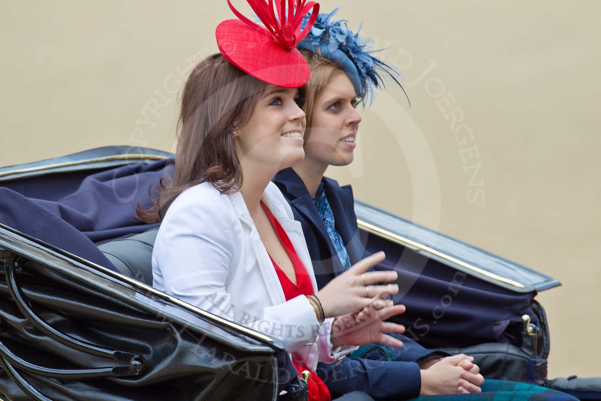 Trooping the Colour 2010: Princess Eugenie of York (in red, on the left), and her younger sister, Princess Beatrice of York, in their barouche on the way from Buckingham Palace to Horse Guards Building, where they are going to watch the parade from the General Major's office, the room that was once used by the Duke of Wellington as his office.

Their parents are Prince Andrew, Duke of York, the second son and third child of Queen Elizabeth II and Prince Philip, Duke of Edinburgh, and Sarah, Duchess of York (born Sarah Ferguson, commonly known as &quot;Fergie&quot;).

Prince Andrew, is sitting opposite to them and is out of sight in all my photos..
Horse Guards Parade, Westminster,
London SW1,
Greater London,
United Kingdom,
on 12 June 2010 at 10:50, image #39