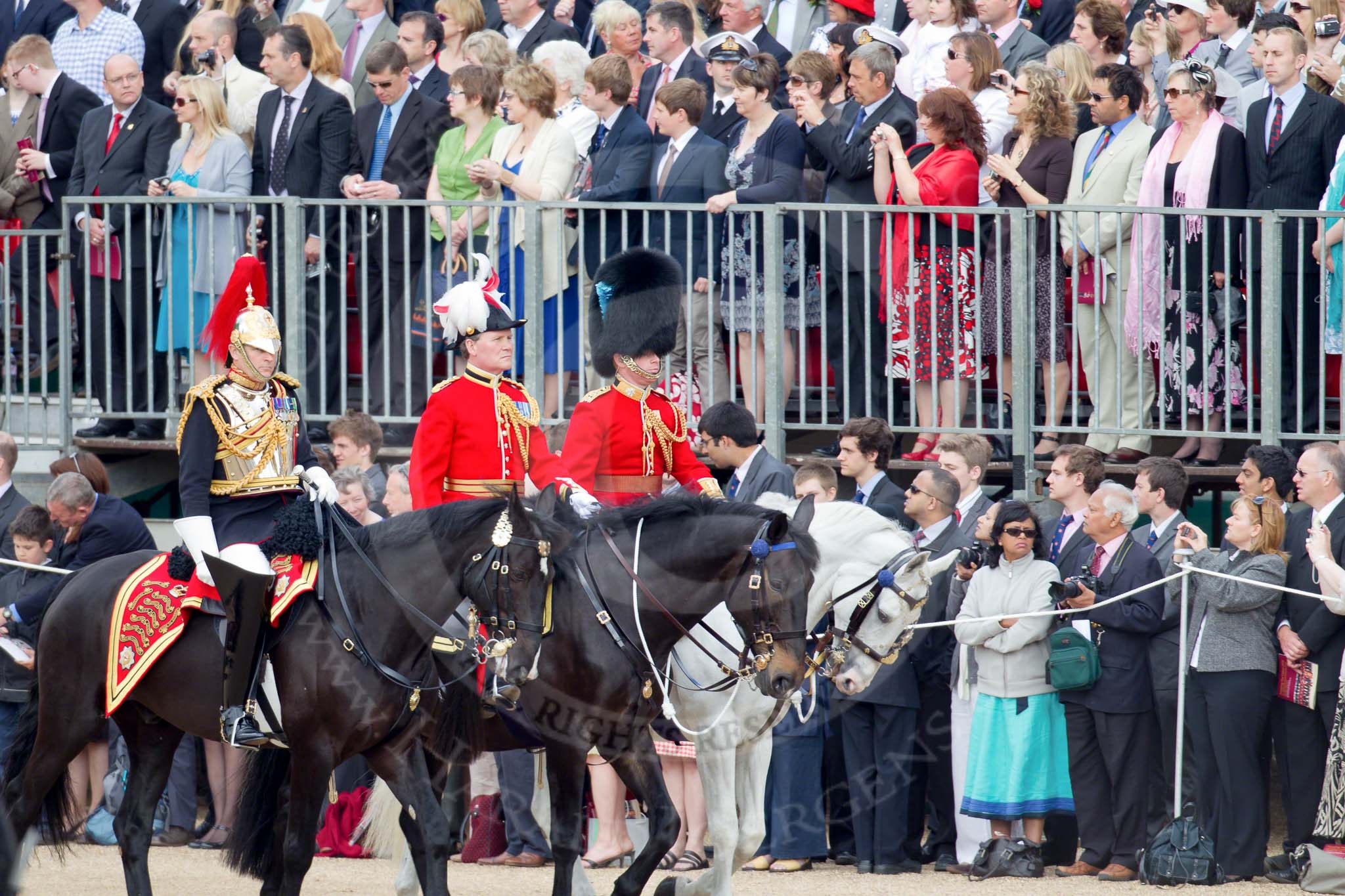 Trooping the Colour 2010: Members of the Royal Procession arriving at Horse Guards Parade. In front, Colonel T W Browne, The Blues and Royals and Silver Stick in Waiting.

In the middle, Colonel A D Mathewson, Chief of Staff London District.

Behind him, Captain G T Murphy, Irish Guards, Aide-de-Camp.

They are riding along the eastern side of the parade ground, next to the Old Admirality Building, spectators are watching from the Inner Line Of Sentries, and one of the stands above..
Horse Guards Parade, Westminster,
London SW1,
Greater London,
United Kingdom,
on 12 June 2010 at 10:59, image #59