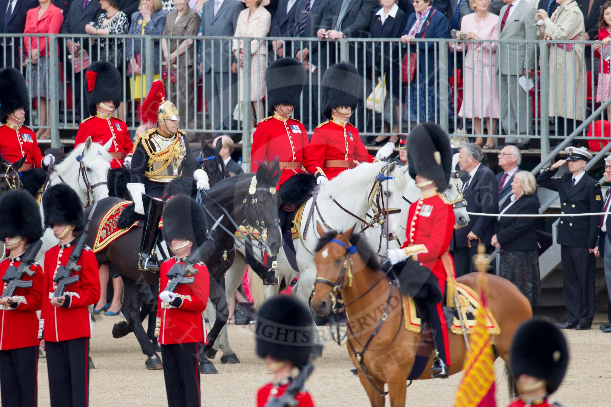 Trooping the Colour 2010: Members of the Royal Procession arriving at Horse Guards Parade. 

On horseback, in front, Lieutenant Colonel J S Olivier,
The Blues and Royals.

In the middle, Major G V A Baker, Grenadier Guards.

Behind him, Major J W S Lawrie, Scots Guards.

In the next row, and further left in the photo, Colonel T C S Bonas, Welsh Guards, and Lt Col J B O'Gorman, Irish Guards.

They are riding along the eastern side of the parade ground, next to the Old Admirality Building, spectators are watching from the Inner Line Of Sentries, and one of the stands above..
Horse Guards Parade, Westminster,
London SW1,
Greater London,
United Kingdom,
on 12 June 2010 at 10:59, image #60