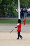 Trooping the Colour 2010: 'March On' - the run-up to the parade. A guardsman of the Grenadier Guards' ('marker') bearing a 'marker flag' that will be used to mark the position of his company on the parade ground..
Horse Guards Parade, Westminster,
London SW1,
Greater London,
United Kingdom,
on 12 June 2010 at 10:18, image #6