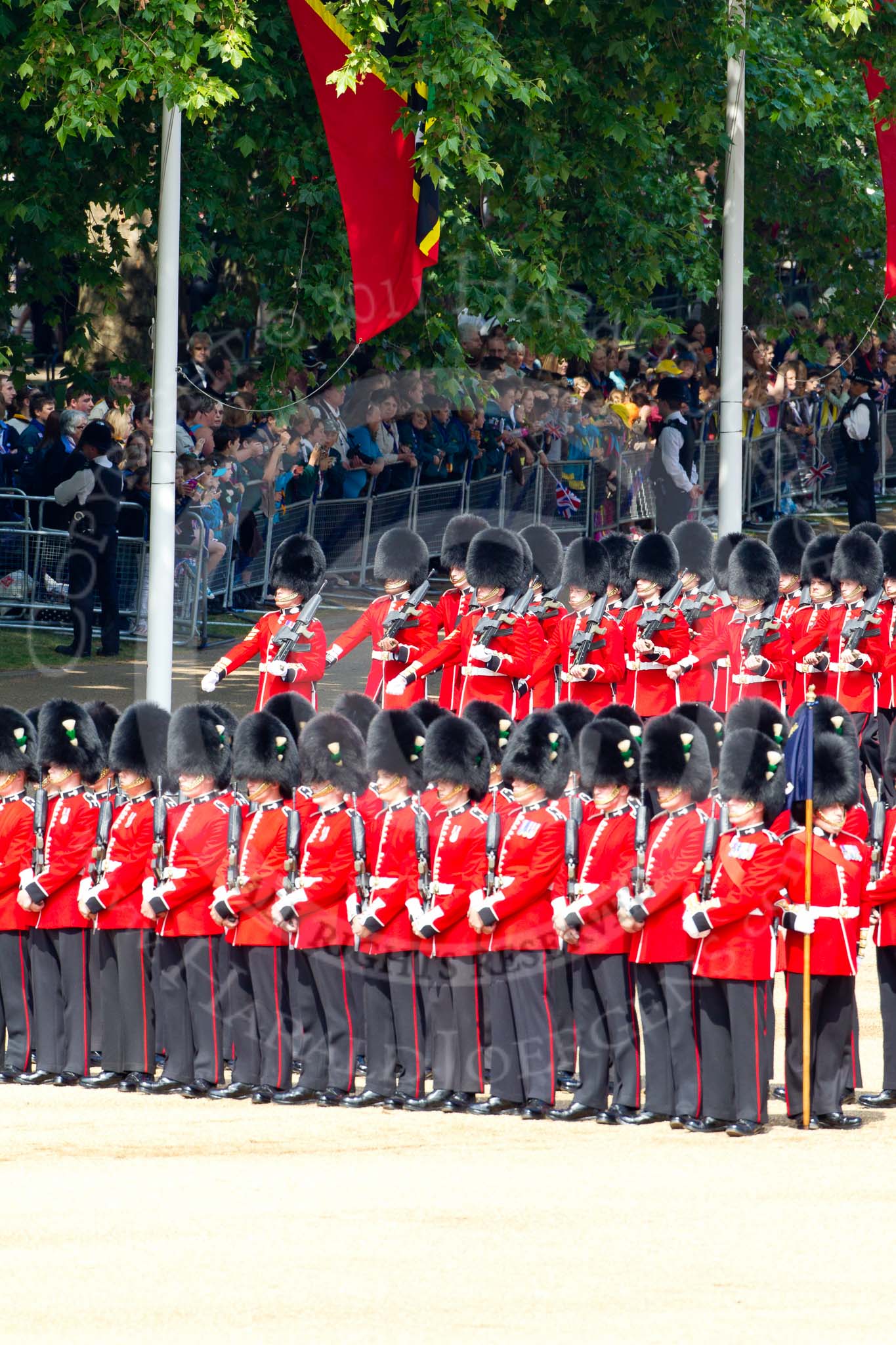 The Colonel's Review 2011: No. 1 Guard, 1st Battalion Scots Guards, the Escort for the Colour, marching onto Horse Guards Parade. In the foreground No. 5 Guard, 1st Battalion Welsh Guards..
Horse Guards Parade, Westminster,
London SW1,

United Kingdom,
on 04 June 2011 at 10:30, image #35