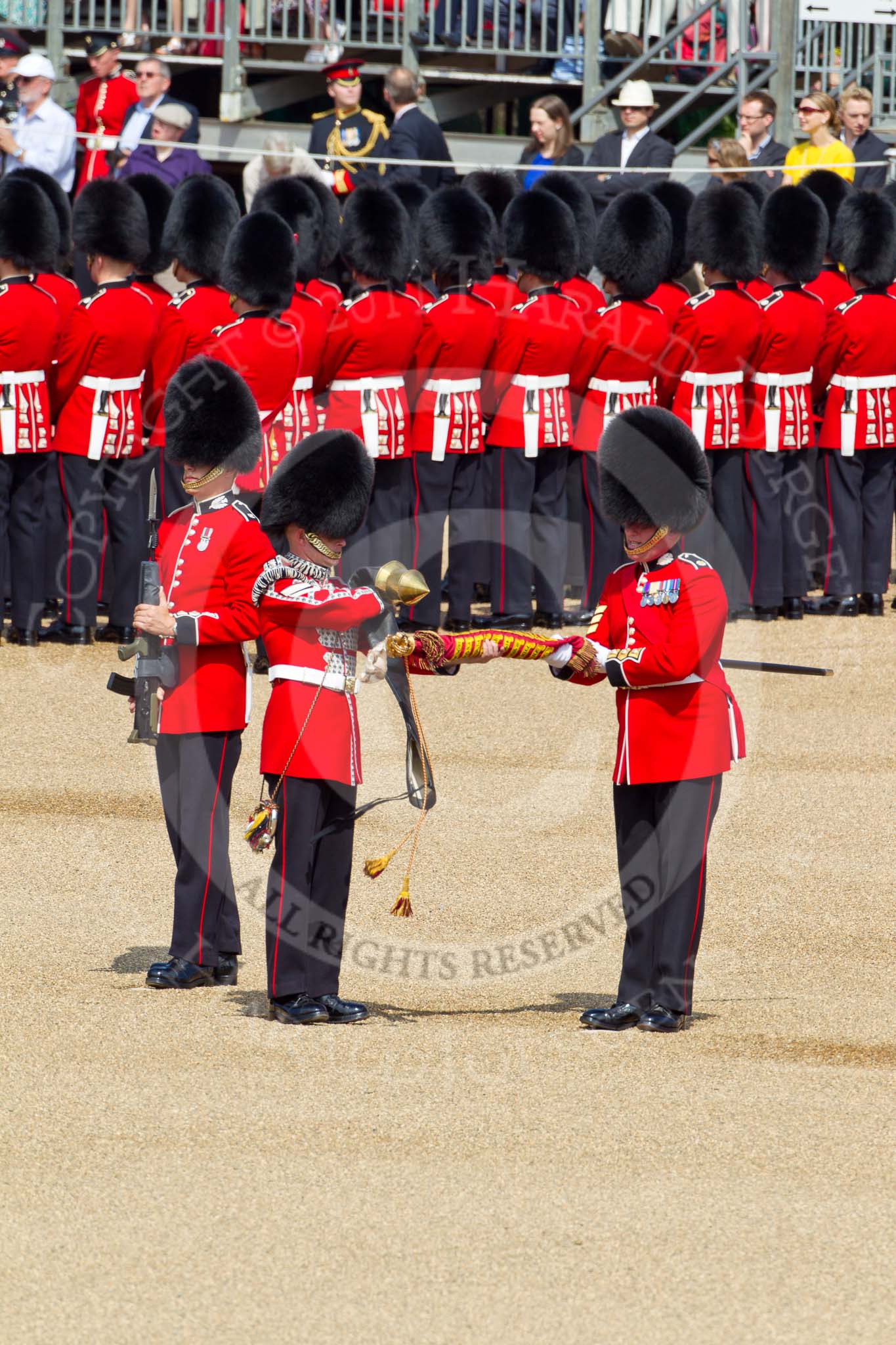The Colonel's Review 2011: Uncasing the Colour. Colour Sergeant Chris Millin is holding the flag, whilst the Duty Drummer removes the colour case. Behind the drummer, presenting arms, one of the two sentries..
Horse Guards Parade, Westminster,
London SW1,

United Kingdom,
on 04 June 2011 at 10:33, image #44