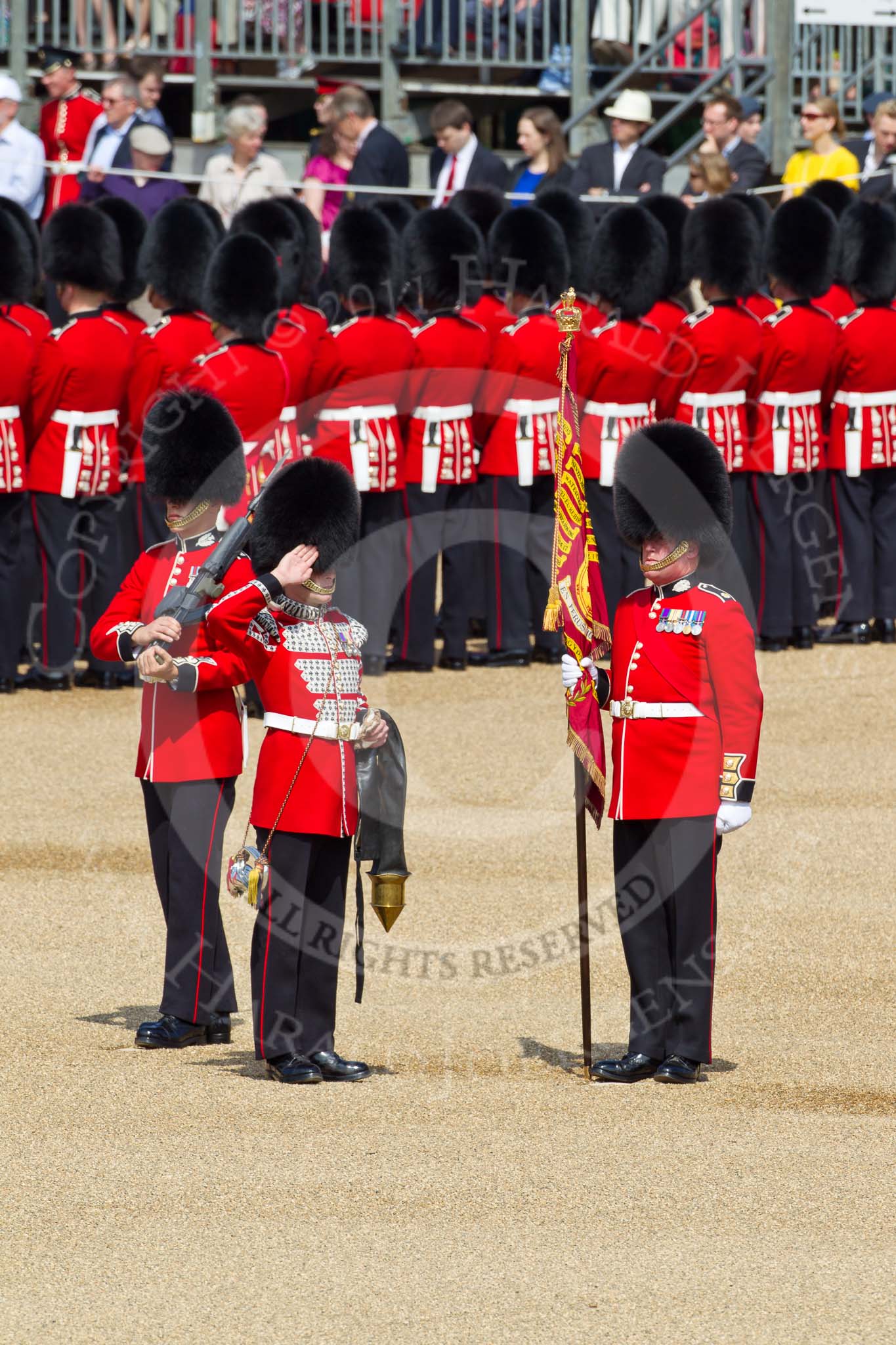 The Colonel's Review 2011: The Colour is uncased. Colour Sergeant Chris Millin is holding the flag, whilst the Duty Drummer, holding the colour case, salutes the Colour. Behind the drummer,  one of the two sentries..
Horse Guards Parade, Westminster,
London SW1,

United Kingdom,
on 04 June 2011 at 10:34, image #48