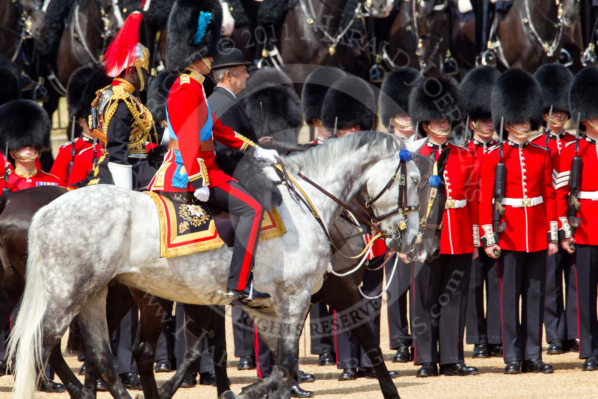 The Colonel's Review 2011: During the Colonel's Review, here inspecting the line, HRH Prince William, The Duke of Cambridge, behind him  the Queen's Stud Groom, standing in for the Prince of Wales, and behind, in place of the Princess Royal, Major Twumasi-Ankrah, Blues and Royals..
Horse Guards Parade, Westminster,
London SW1,

United Kingdom,
on 04 June 2011 at 11:03, image #93