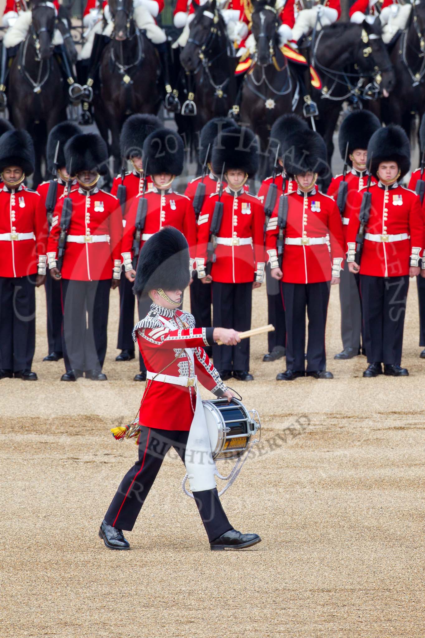 The Colonel's Review 2011: The 'Lone Drummer', Lance Corporal Gordon Prescott, Scots Guards, marching past the line of guards, to play the 'Drummers Call' that will start the next phase of the parade..
Horse Guards Parade, Westminster,
London SW1,

United Kingdom,
on 04 June 2011 at 11:15, image #120