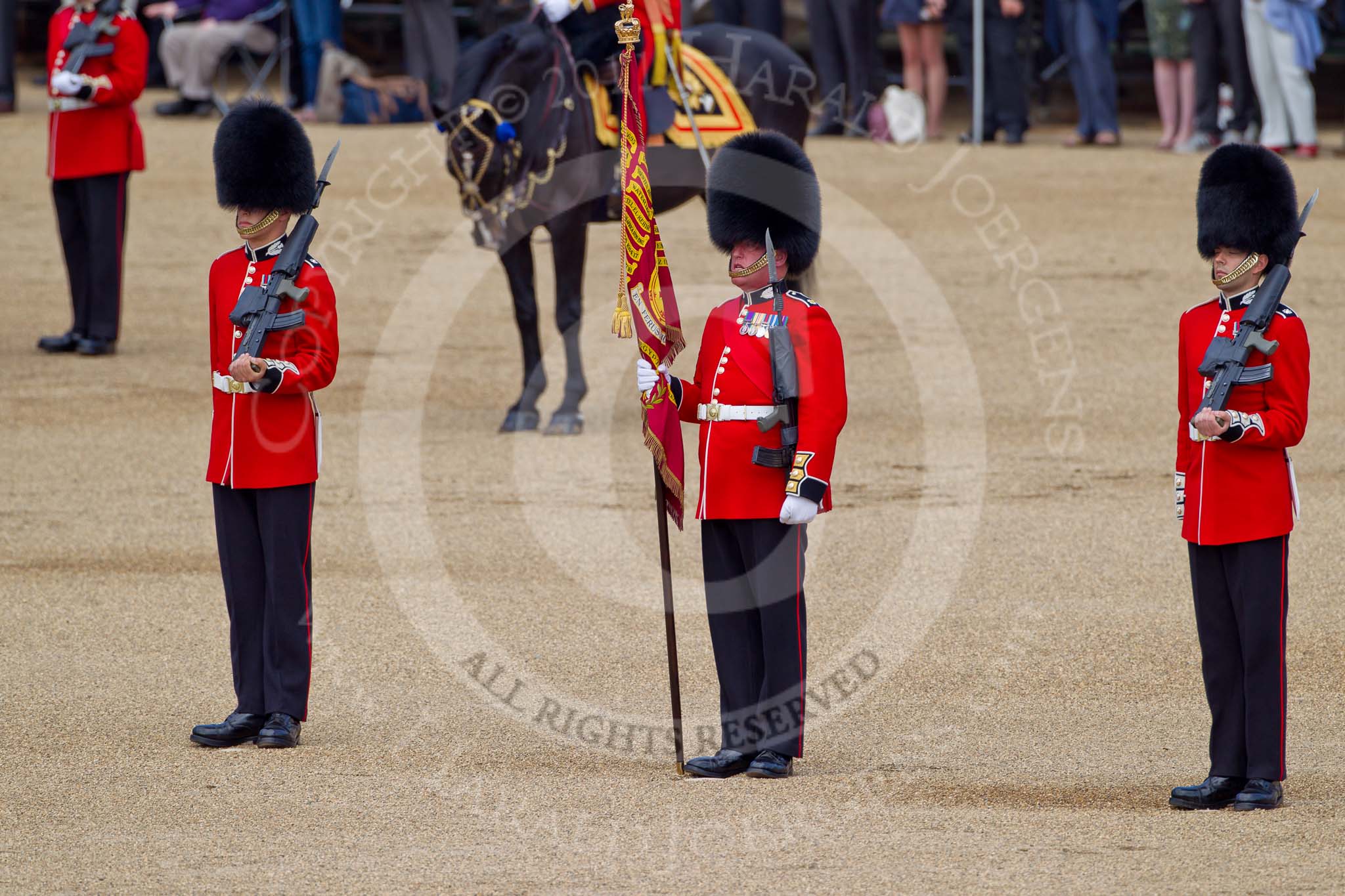 The Colonel's Review 2011: Colour Sergeant Chris Millin, standing between the two sentries, holding the Colour, shortly before handing it over to the Escort for the Colour..
Horse Guards Parade, Westminster,
London SW1,

United Kingdom,
on 04 June 2011 at 11:18, image #127
