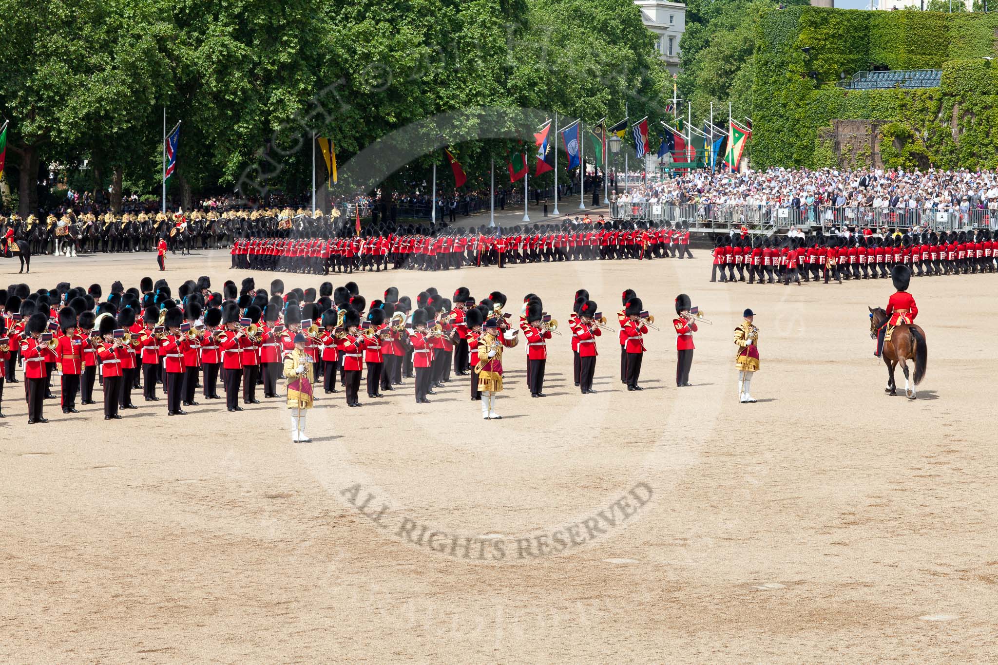 The Colonel's Review 2011: The guards are about to complete the March Past in slow time. On the left, standing in the Centre of Horse Guards Parade, the Massed Bands, on the right side, riding towards the head of the parade, the Field Officer..
Horse Guards Parade, Westminster,
London SW1,

United Kingdom,
on 04 June 2011 at 11:47, image #218