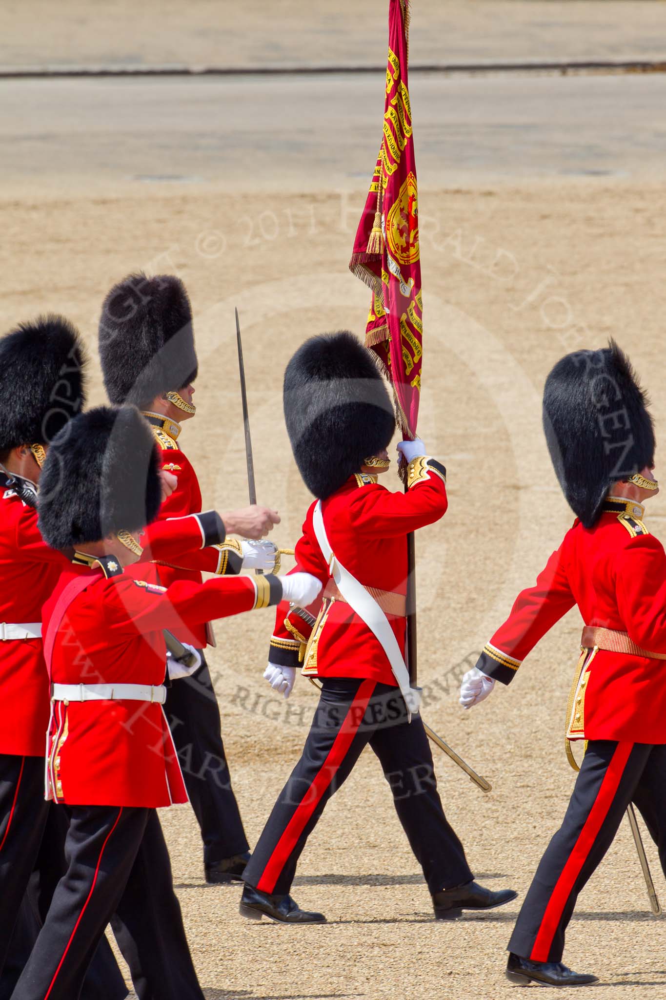 The Colonel's Review 2011: Marching off at the end of the rehearsal. carrying the Colour is the Ensign, Lieutenant Tom Ogilvy, left to him the Subaltern of the Escort, Captain Krause-Harder-Colthorpe..
Horse Guards Parade, Westminster,
London SW1,

United Kingdom,
on 04 June 2011 at 12:08, image #293