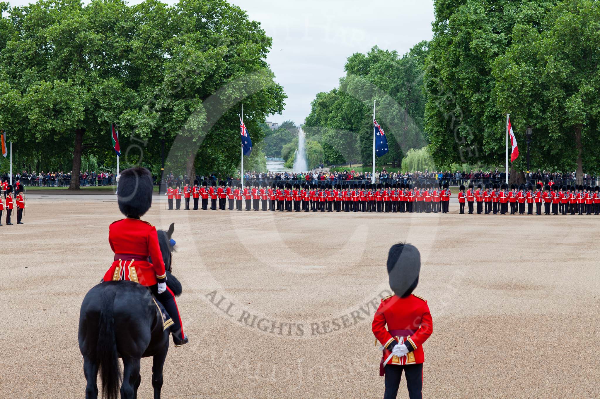 The Major General's Review 2011: A general view of the Massed Bands on the left and the Escort for the Colour and No. 2 Guard (found by 1st Battalion Scots Guards). The Officers are to take post shortly. Standing with their backs to the camera is Major Ben Ramsay, Welsh Guards (the Senior Major on Parade and mounted) and Major Rory Shannon, Company Commander of Right Flank Company, 1st Battalion Scots Guards; the company which finds the Escort for the Colour..
Horse Guards Parade, Westminster,
London SW1,
Greater London,
United Kingdom,
on 28 May 2011 at 10:39, image #71