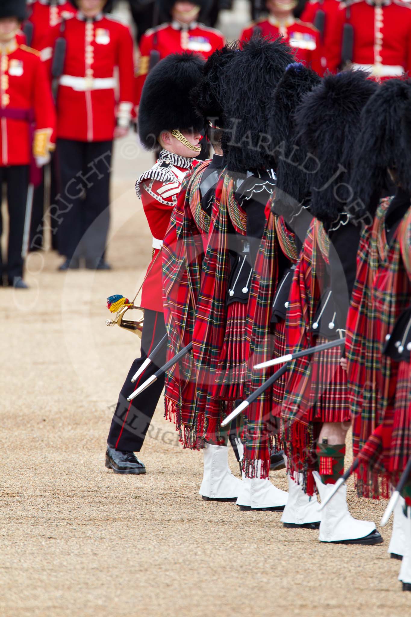 The Major General's Review 2011: The Lone Drummer, Lance Corporal Gordon Prescott, has left the line, marching to a position at the right of the Escort to the Colour, where he will bear the 'drummers call', which will start the next phase of the parade. Here he is passing the Pipers of the Band of the Scots Guards..
Horse Guards Parade, Westminster,
London SW1,
Greater London,
United Kingdom,
on 28 May 2011 at 11:15, image #151