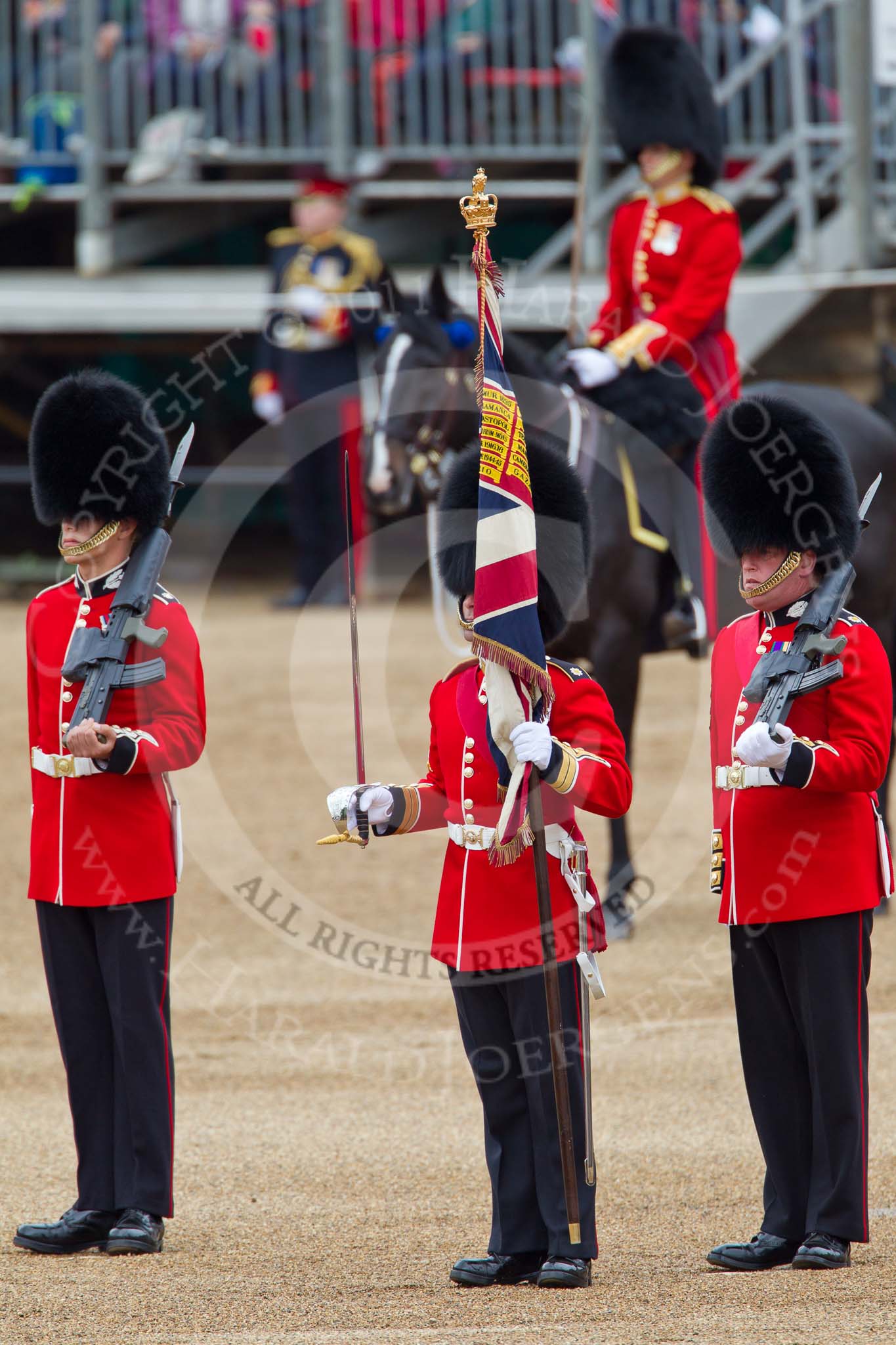 The Major General's Review 2011: The Regimental Sergeant Major, WO1 A I Mackenzie, holding the Colour. Behind, the Colour Party that had been keeping the Colour, Colour Sergeant Chris Millin on the right, a sentry on the left..
Horse Guards Parade, Westminster,
London SW1,
Greater London,
United Kingdom,
on 28 May 2011 at 11:20, image #158