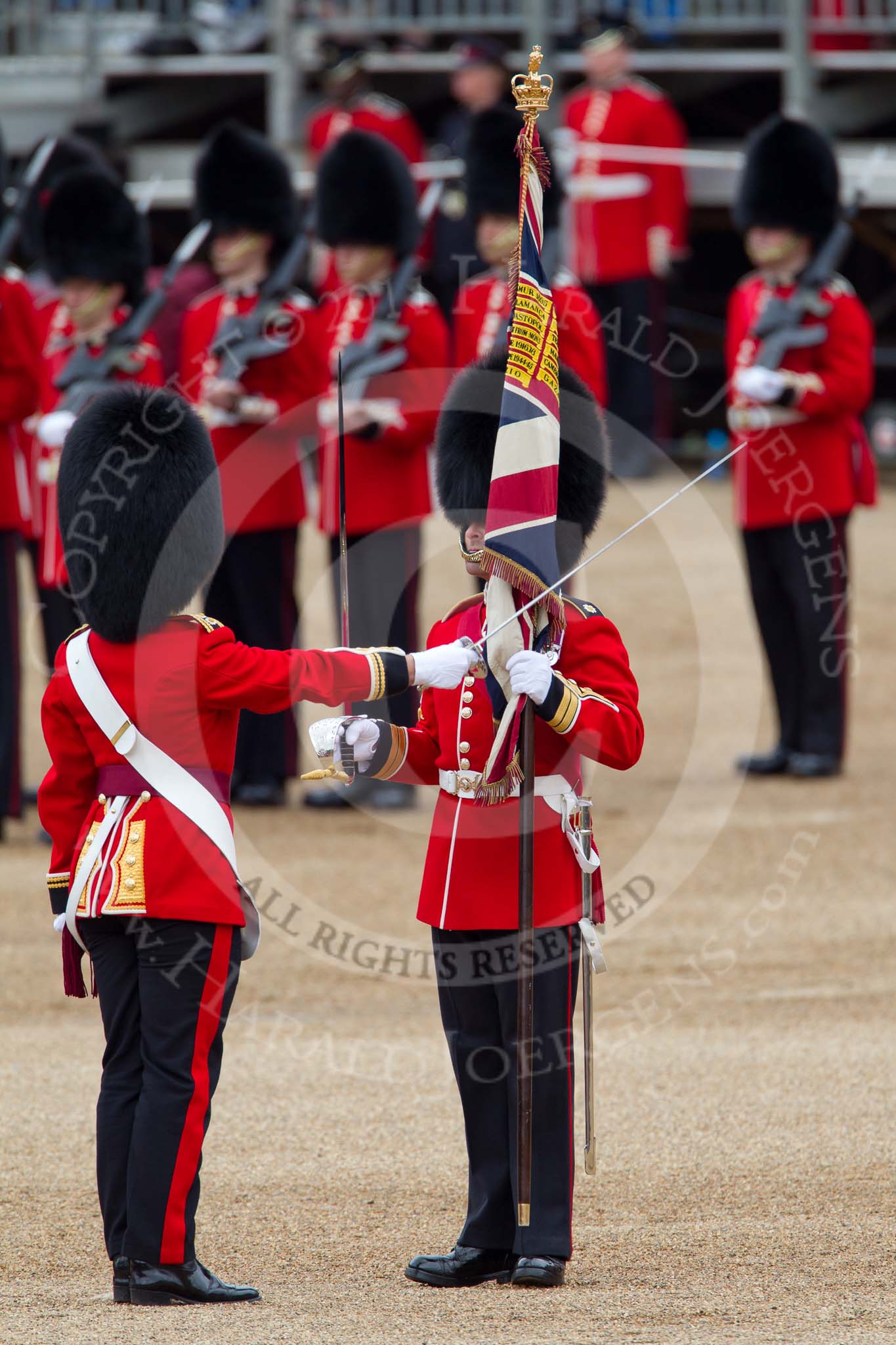 The Major General's Review 2011: The Regimental Sergeant Major,  WO1 A I Mackenzie, is about to hand the Colour over to the Ensign on the left..
Horse Guards Parade, Westminster,
London SW1,
Greater London,
United Kingdom,
on 28 May 2011 at 11:20, image #160